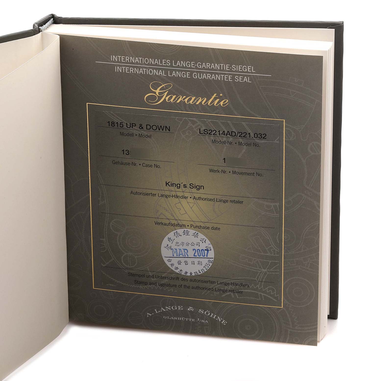 The image shows the warranty certificate booklet for the 1815 model by A. Lange 
Söhne, opened flat.