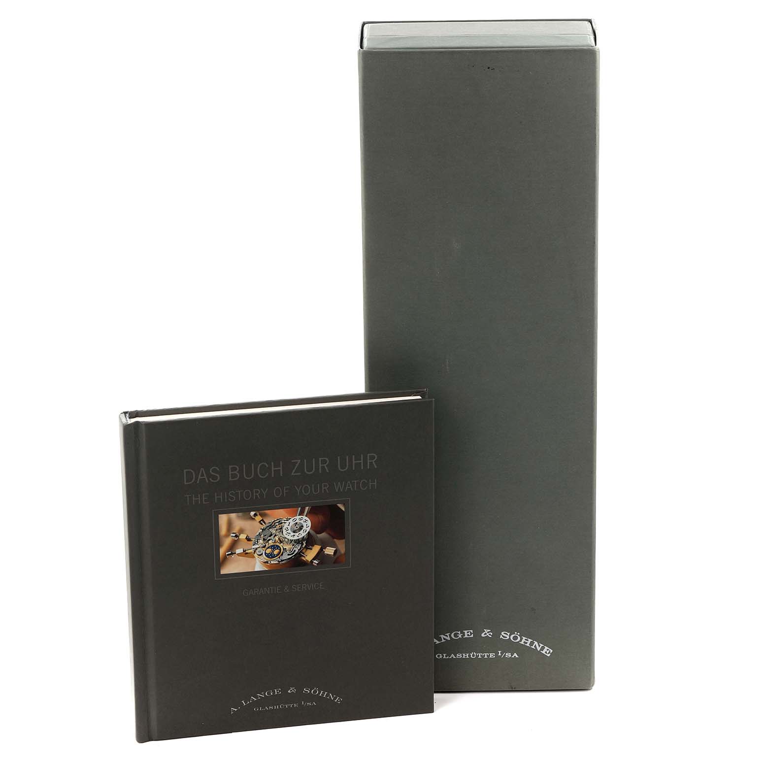 The image shows the packaging and booklet for the 1815 model by A. Lange 
Söhne, viewed from the front.