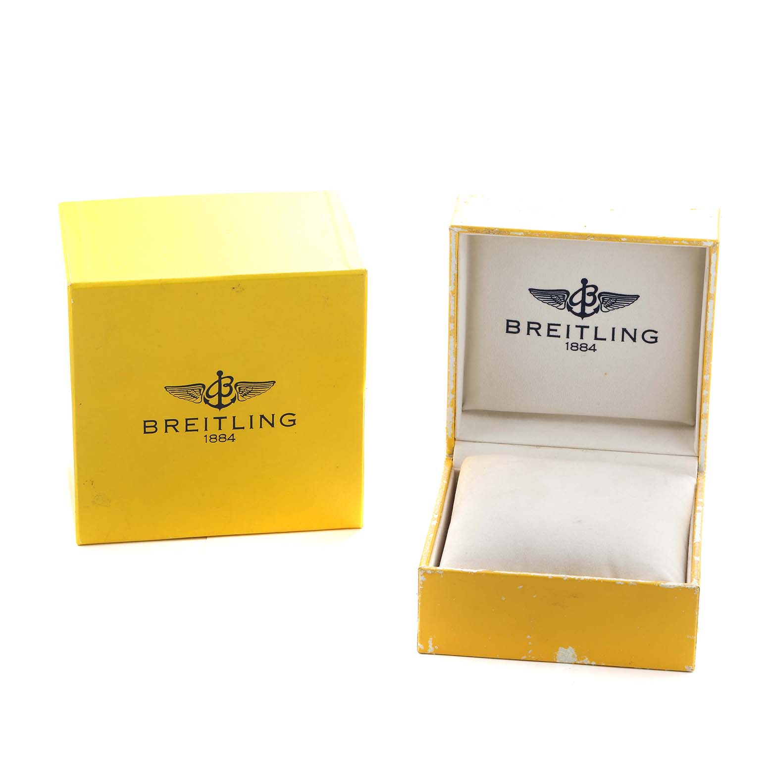 The image shows the Breitling Avenger A3239011/C930 Men's Stainless Steel Mother of Pearl Dial watch's yellow branded box and an open watch case with a cushion inside.