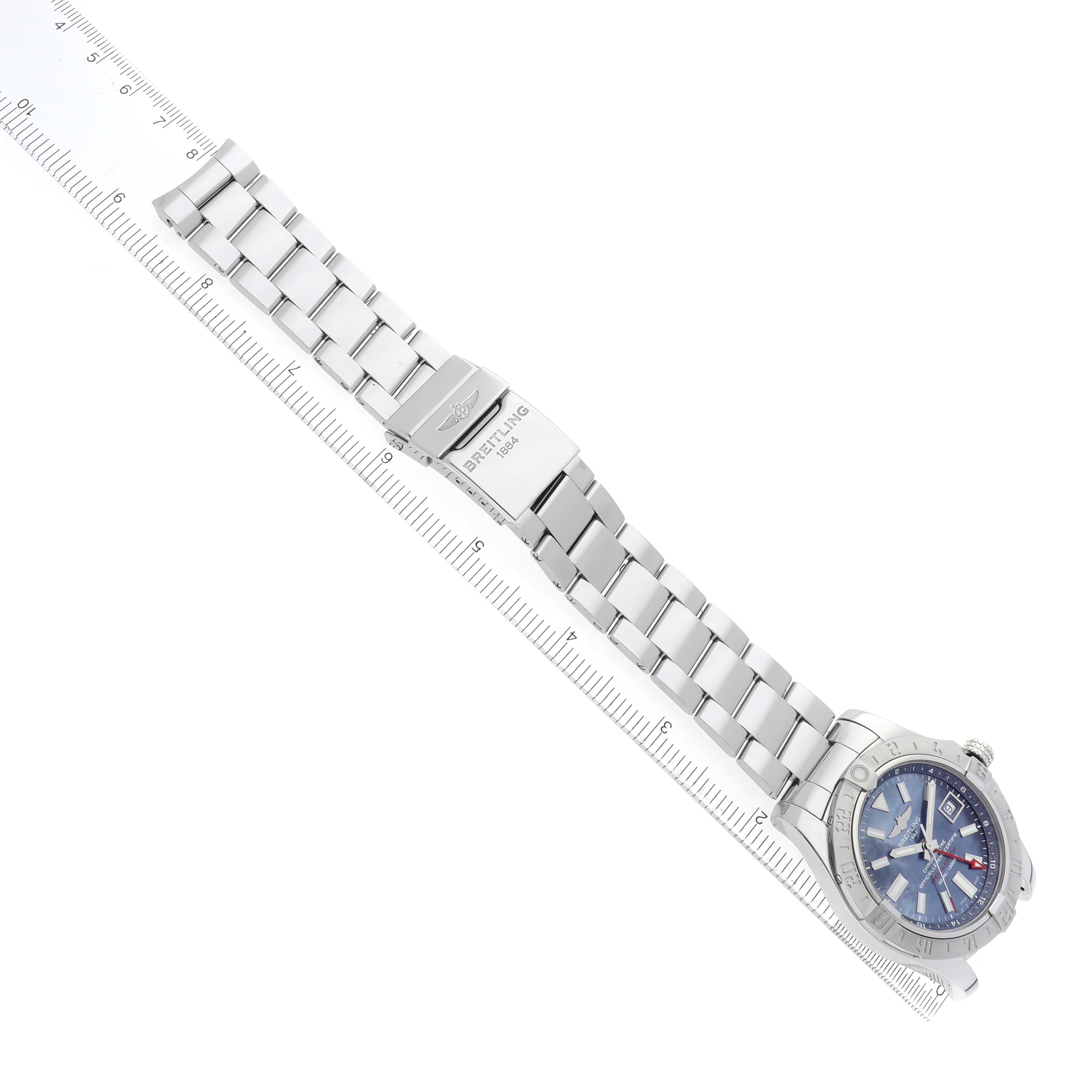 The image shows the Breitling Avenger A3239011/C930 Men's Stainless Steel Mother of Pearl Dial watch and its metal bracelet at a diagonal angle, highlighting the clasp and face.