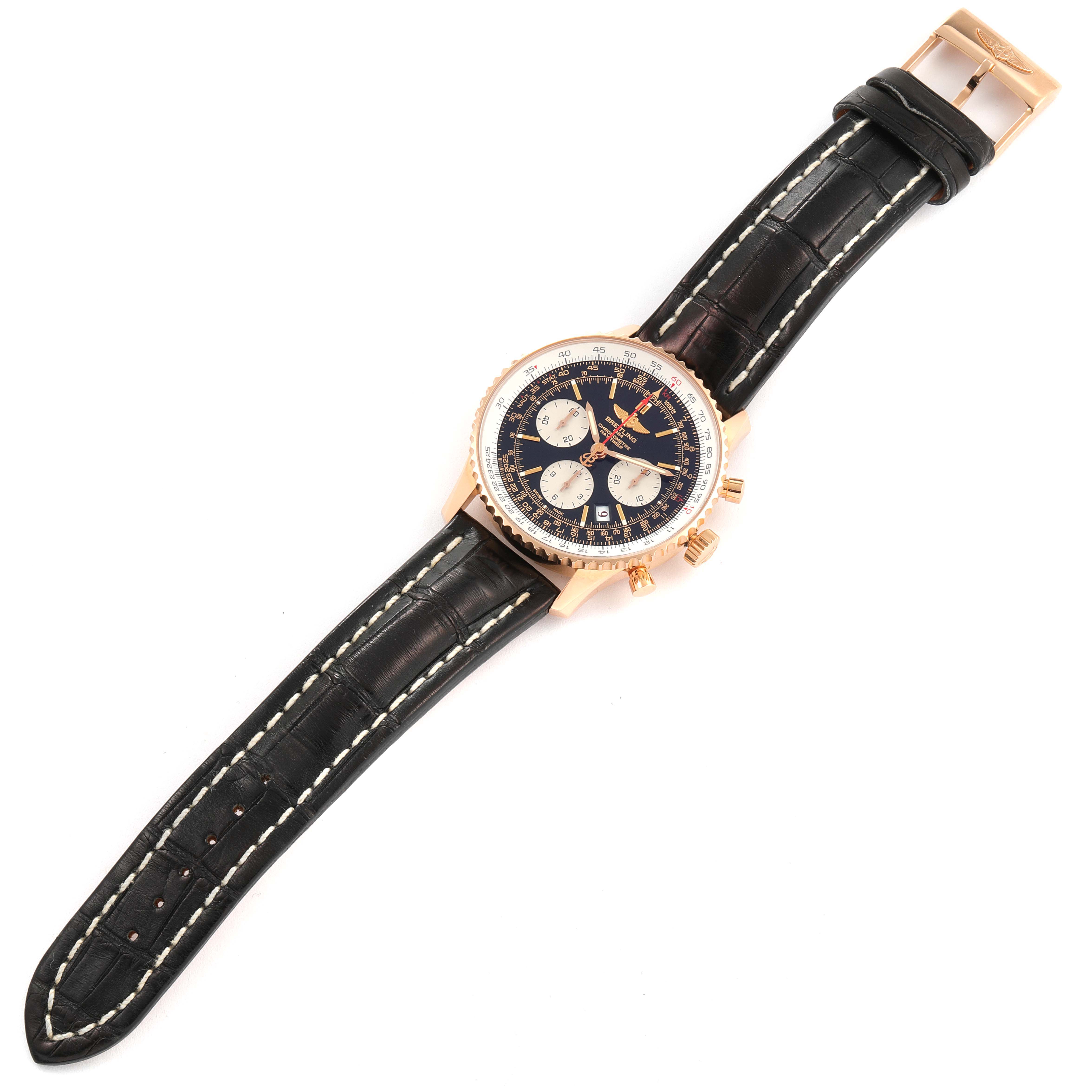 The image shows a top-down view of a Breitling Navitimer RB0121 Men's Rose Gold Black Dial RB0121 Men's Rose Gold Black Dial watch, showcasing the leather strap, dial, and bezel.