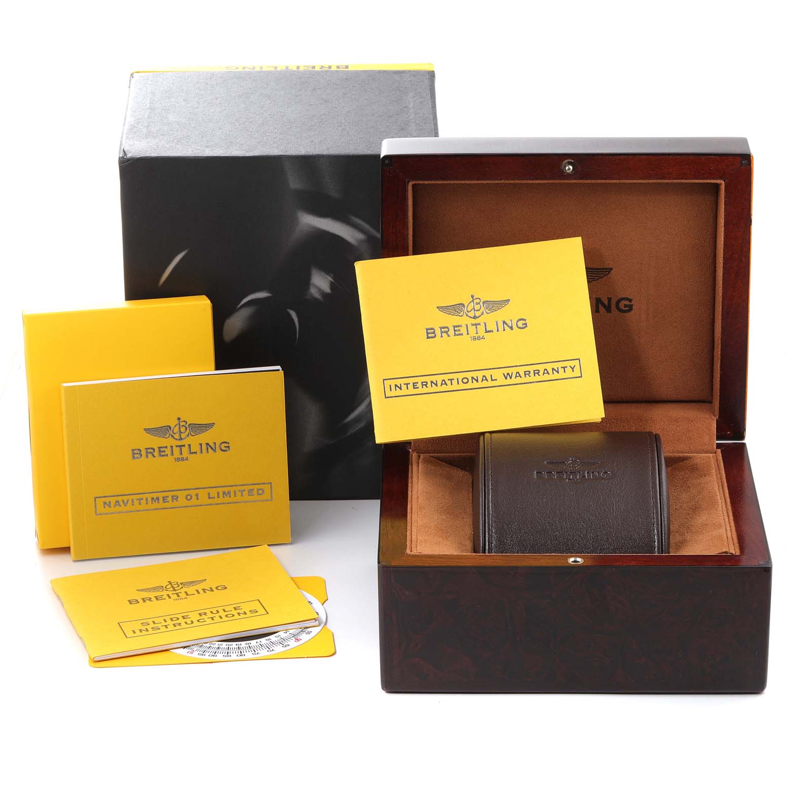 The image shows a Breitling Navitimer RB0121 Men's Rose Gold Black Dial RB0121 Men's Rose Gold Black Dial watch box, instruction manuals, warranty card, and a leather watch case.