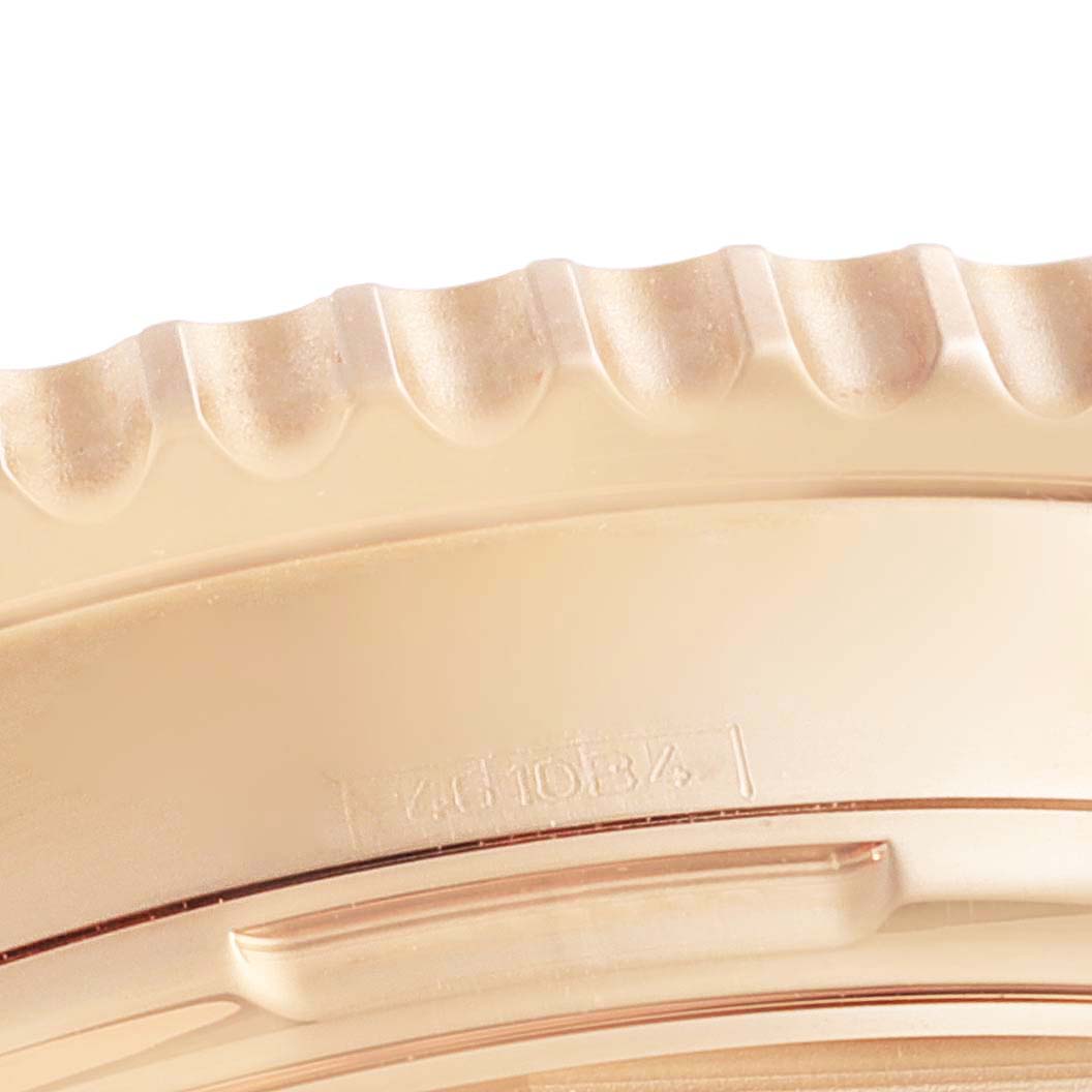This close-up image shows the detailed ridges on the bezel of a Breitling Navitimer RB0121 Men's Rose Gold Black Dial RB0121 Men's Rose Gold Black Dial watch.