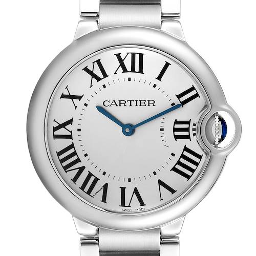 The Cartier Ballon Bleu watch is shown from the front, highlighting the dial, roman numerals, hands, and crown.