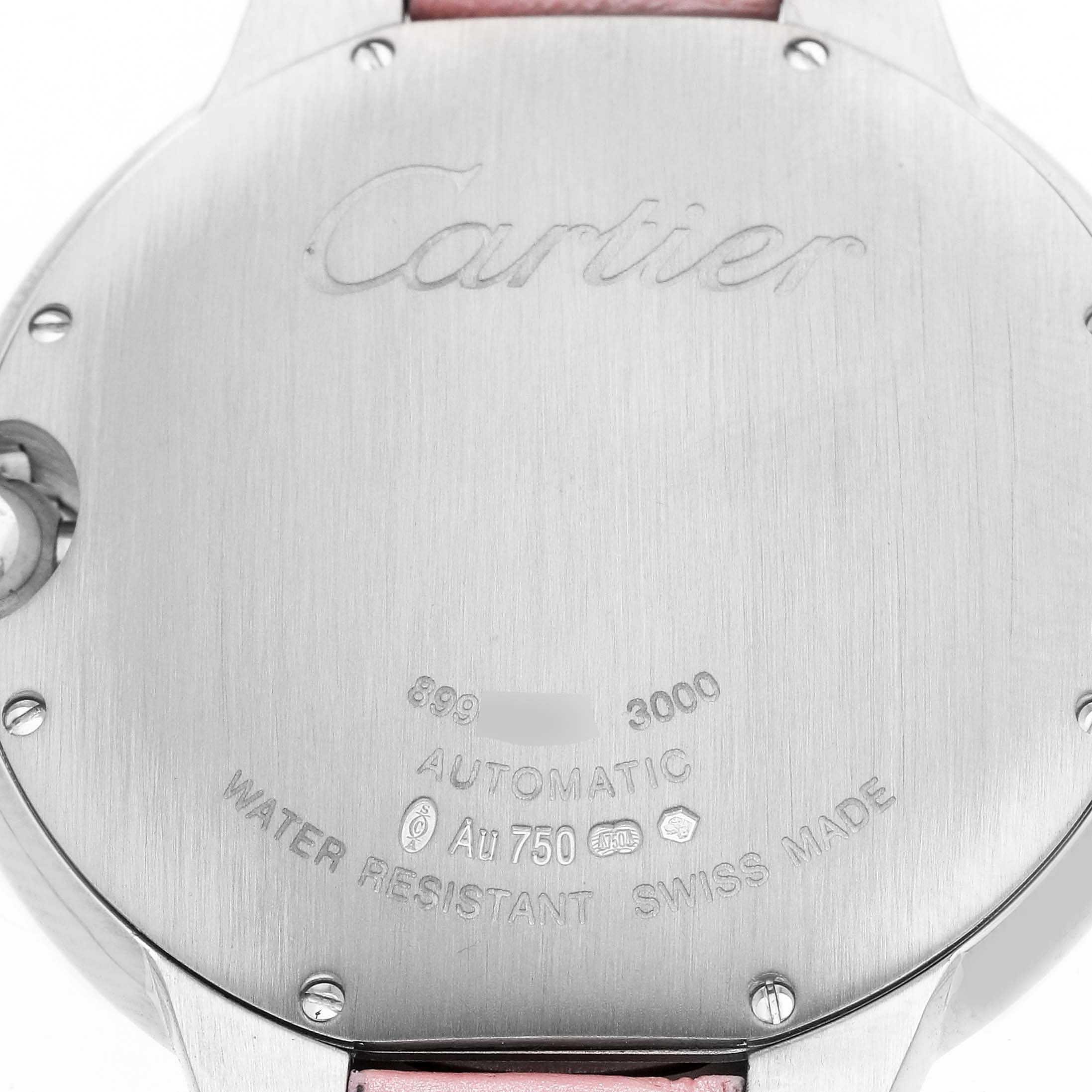 The image shows the back casing of a Cartier Ballon Bleu WJBB0032 Men's White Gold Silver Dial watch with engraved details and screws visible.