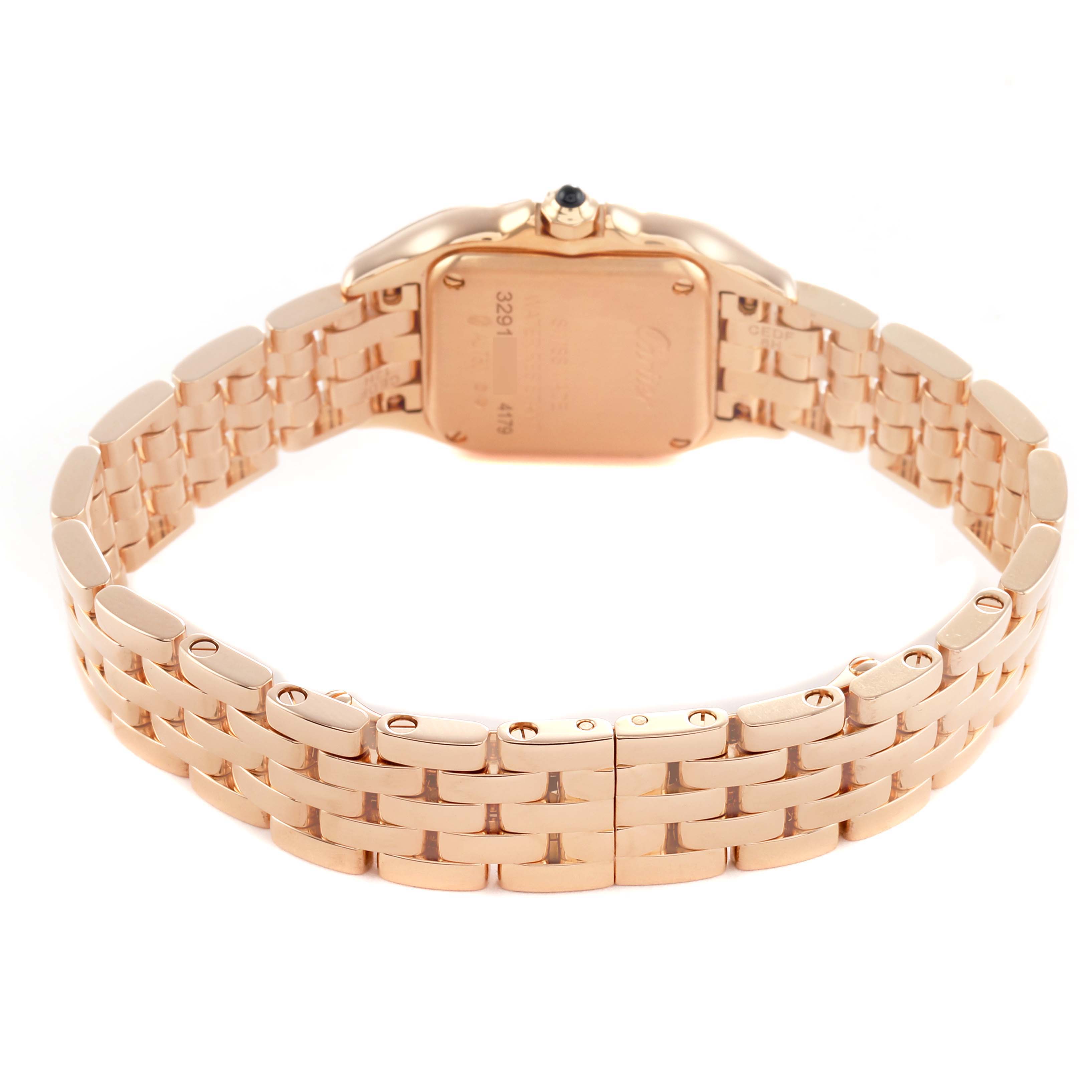 The Panthere de Cartier watch is shown from the rear, highlighting its gold bracelet and case back.