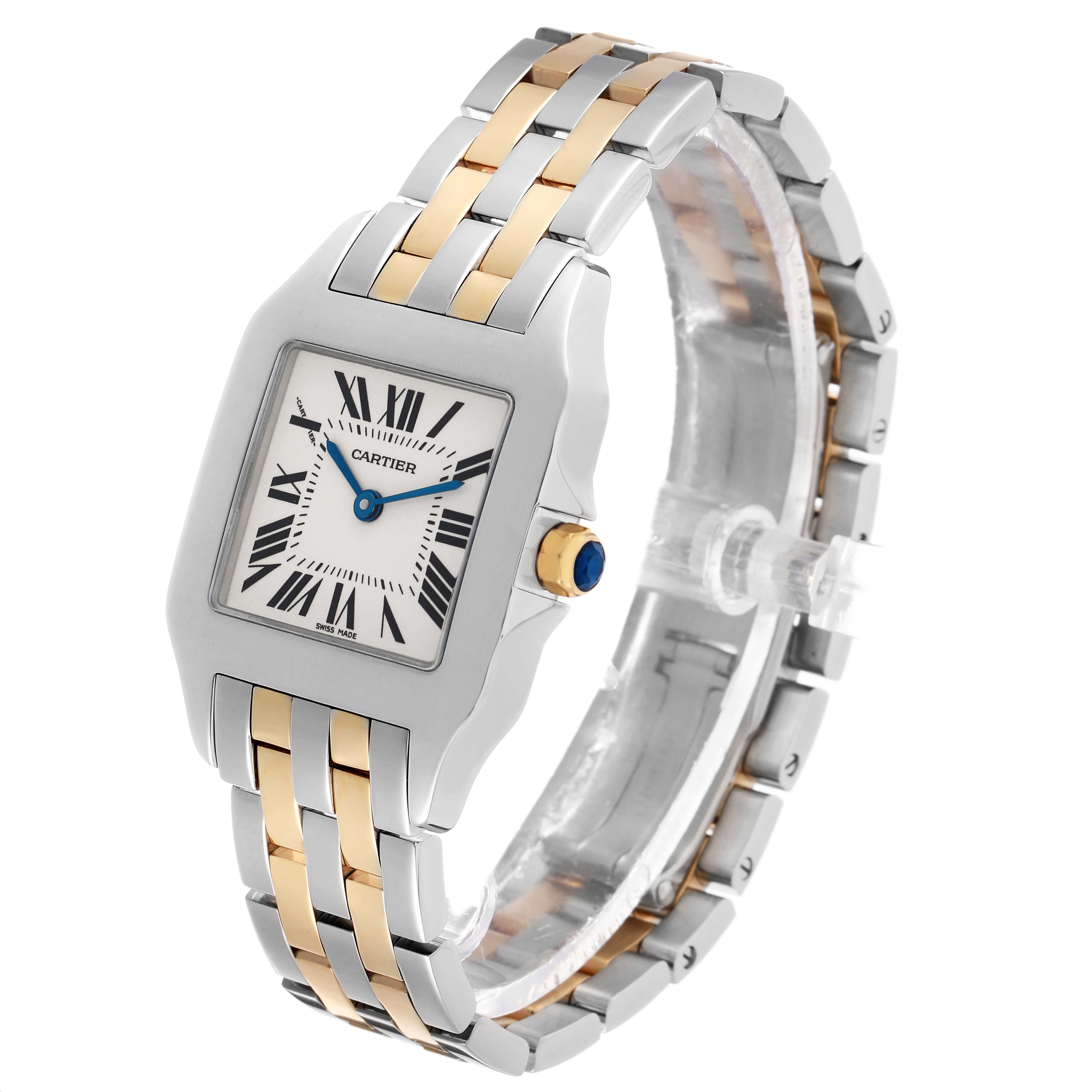 The Santos Demoiselle by Cartier is shown at an angled side view, highlighting its square face, gold and silver bracelet, and blue cabochon crown.