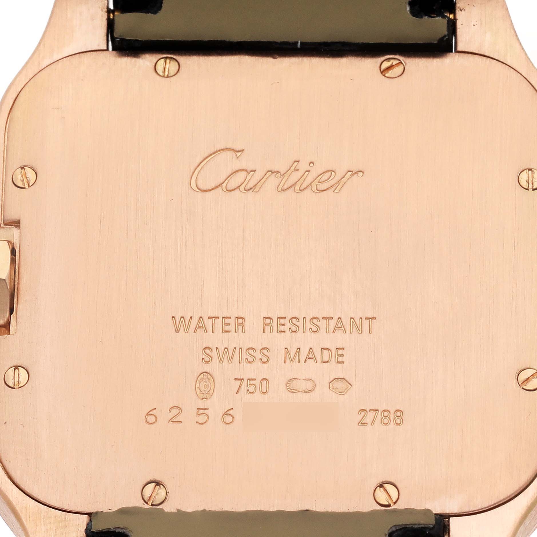 The image shows the back case of a Cartier Santos Dumont W2009251 Men's Rose Gold Silver Dial watch with engraved branding and specifications.