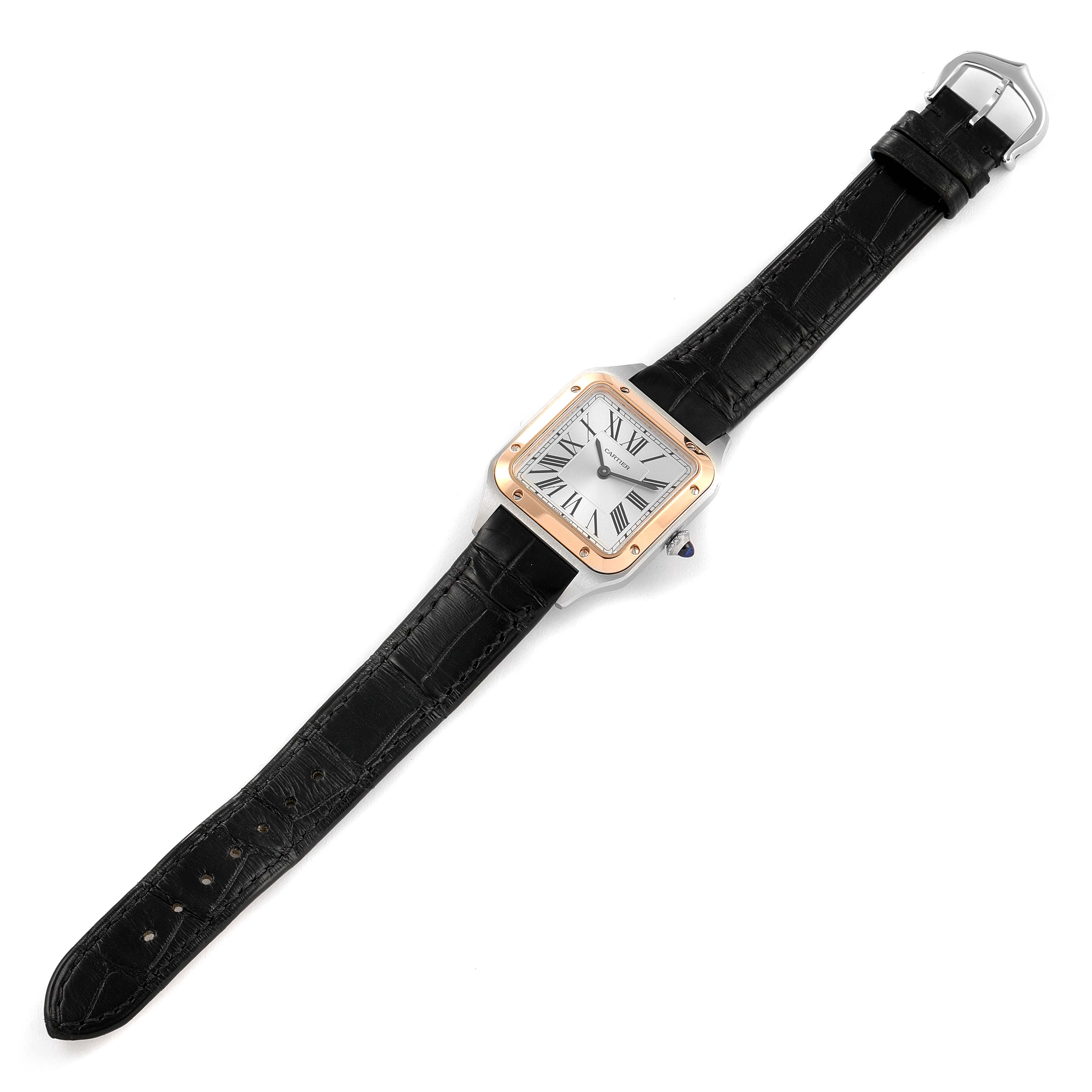 The Cartier Santos W2SA0012 Women's Steel and Gold (two tone) Silver Dial W2SA0012 Women's Steel and Gold (two tone) Silver Dial watch is shown in a top-down view featuring the face, bezel, crown, and full leather strap.