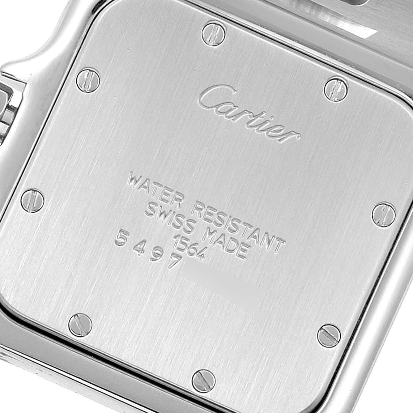 The image shows the case back of a Cartier Santos W20060D6 Men
s Stainless Steel Silver Dial W20060D6 Men
s Stainless Steel Silver Dial watch, featuring engraved details and secured with screws.