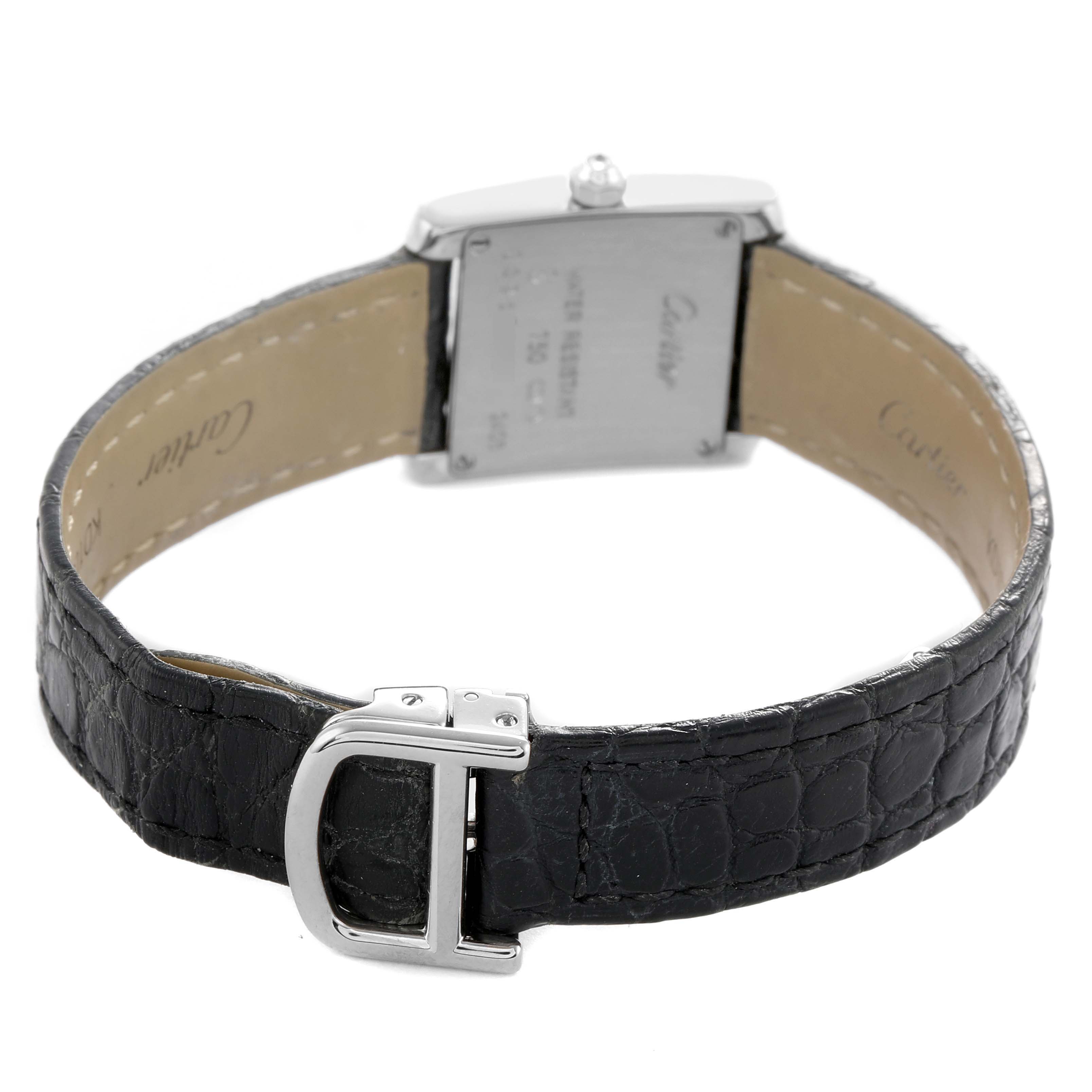 The Cartier Tank Francaise WE100251 Women's White Gold Silver Dial watch is shown from the back, highlighting the clasp, leather strap, and case back.