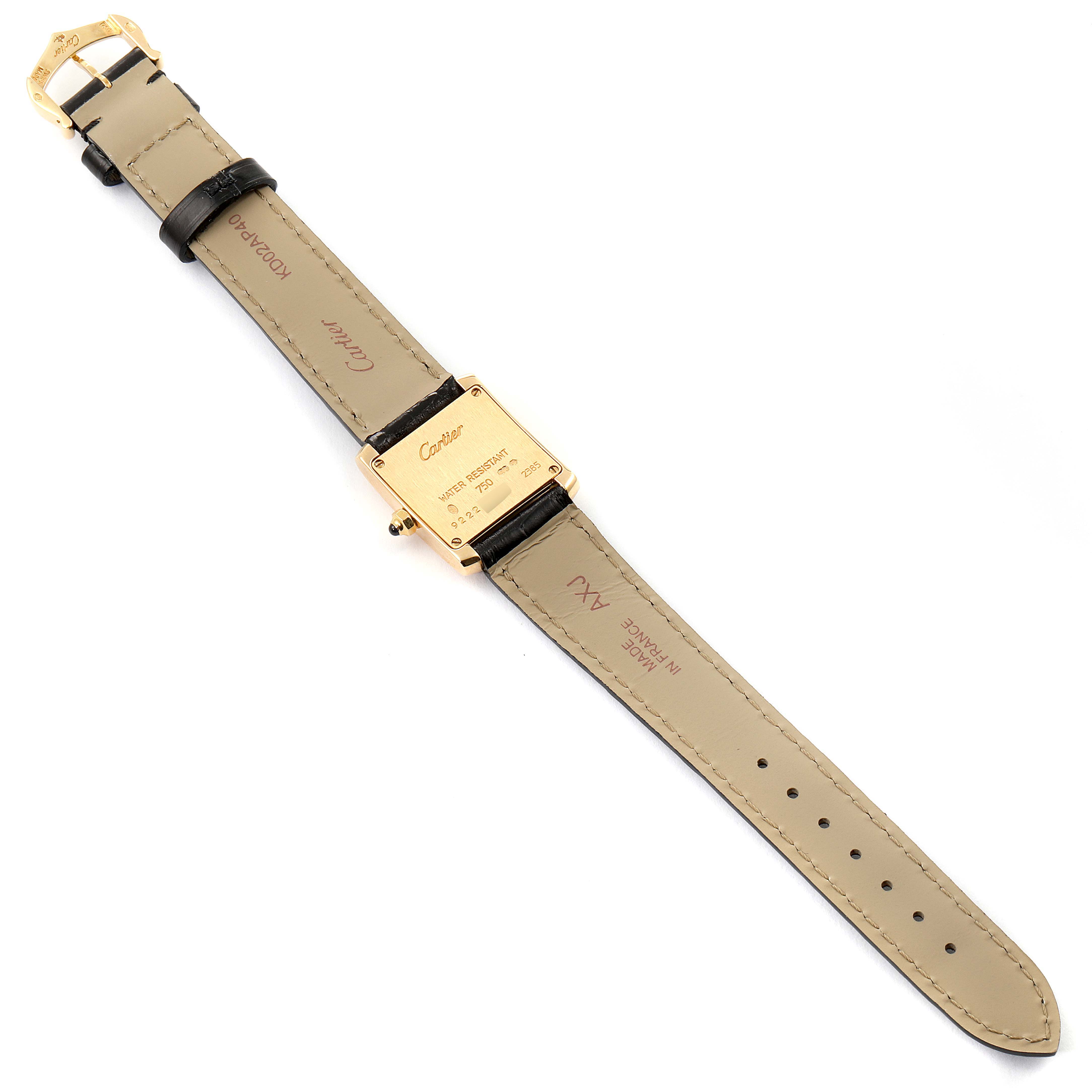 The image shows the back view of a Cartier Tank Francaise W5000256 Women's Yellow Gold Silver Dial W5000256 Women's Yellow Gold Silver Dial watch lying flat, highlighting the case back and leather straps.