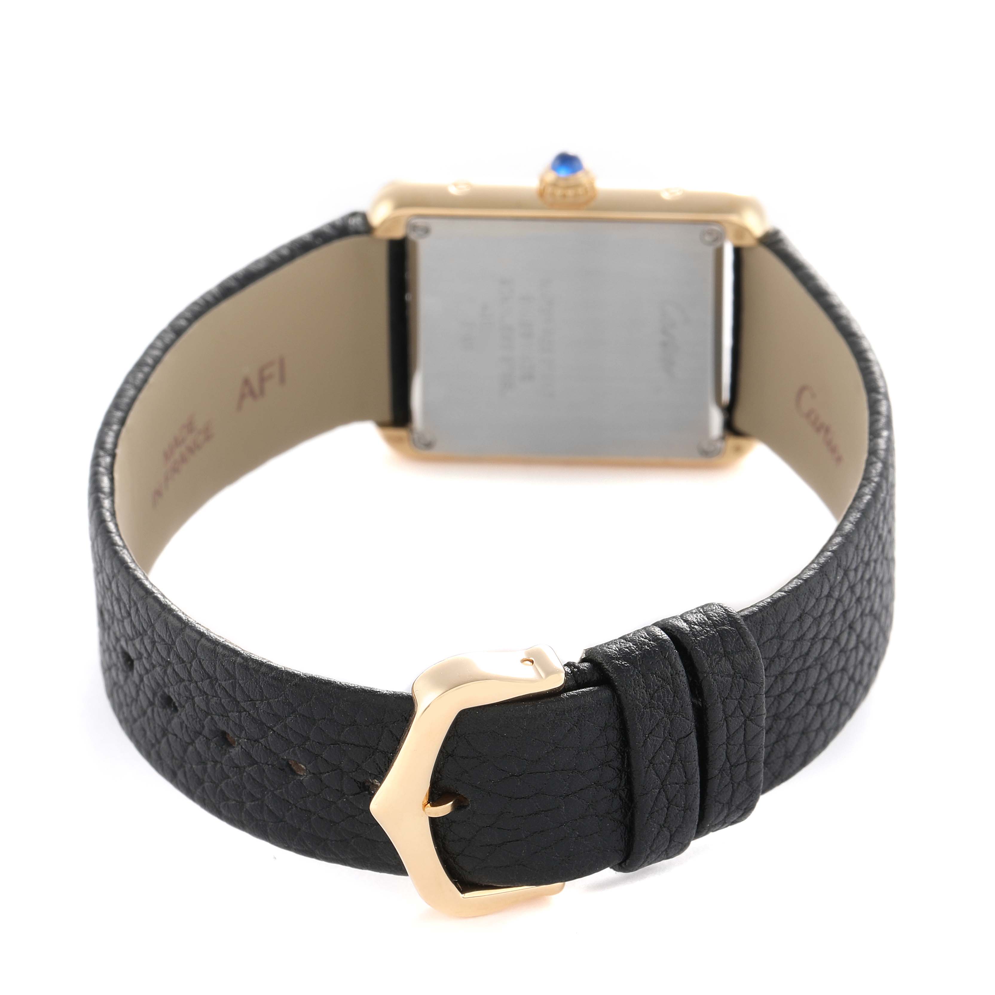 The Cartier Tank Solo W5200002 Women's Yellow Gold Silver Dial watch is shown from the back, highlighting its case back, buckle, and black leather strap.