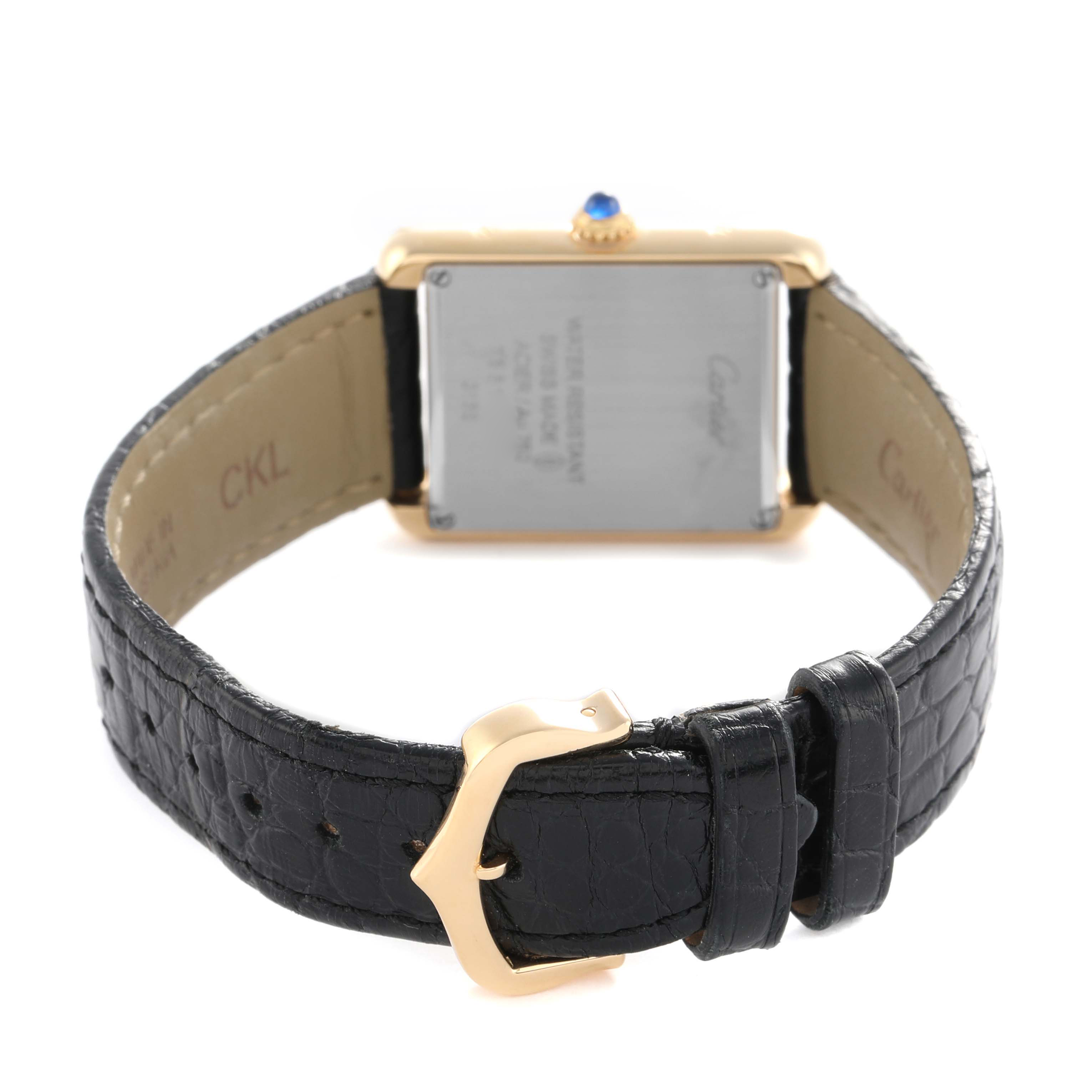 The image shows the back of a Cartier Tank Solo W5200002 Women's Yellow Gold Silver Dial watch, highlighting the clasp, case back, and leather strap.