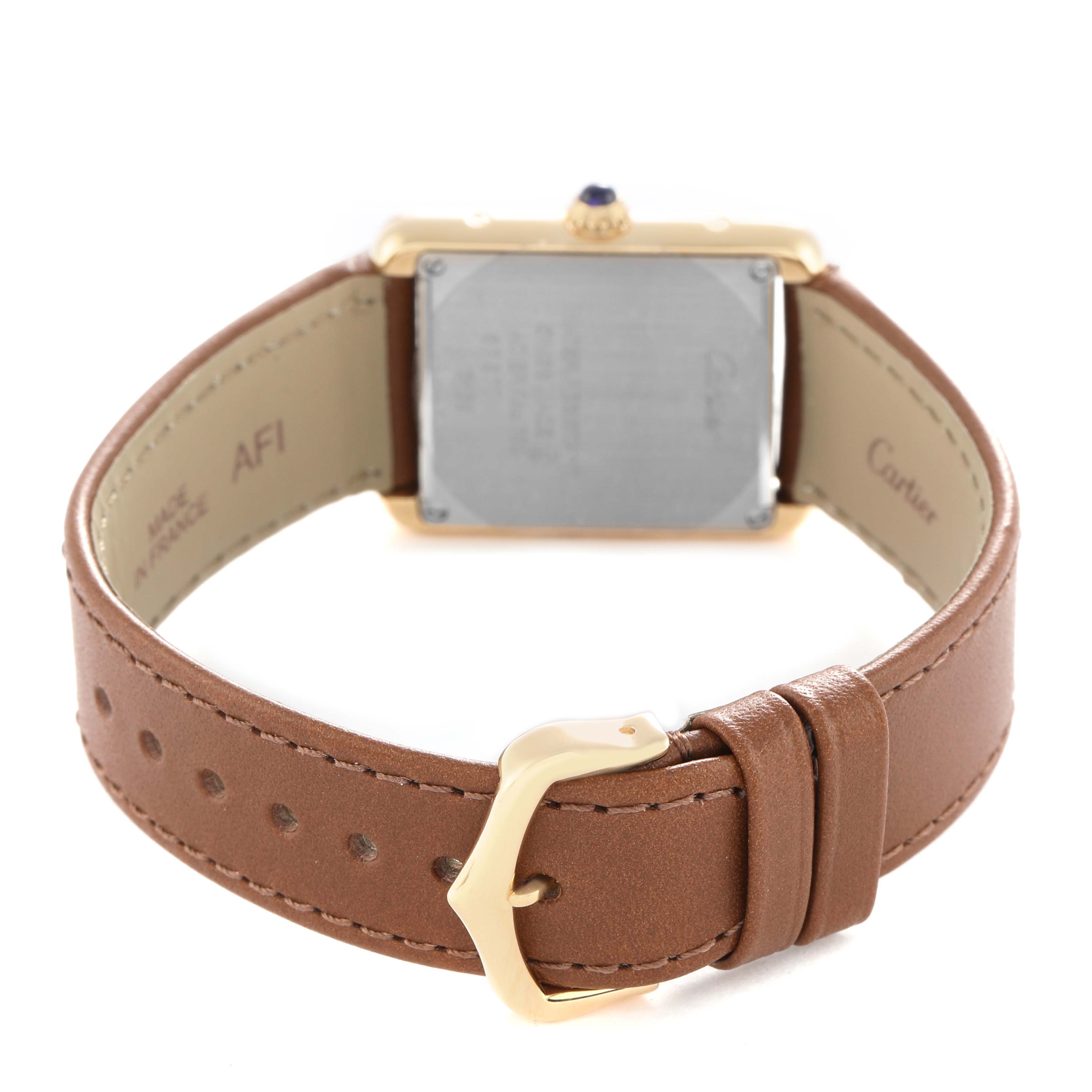 The image shows the back view of a Cartier Tank Solo W5200002 Women's Yellow Gold Silver Dial watch, featuring the case back, leather strap, and buckle.