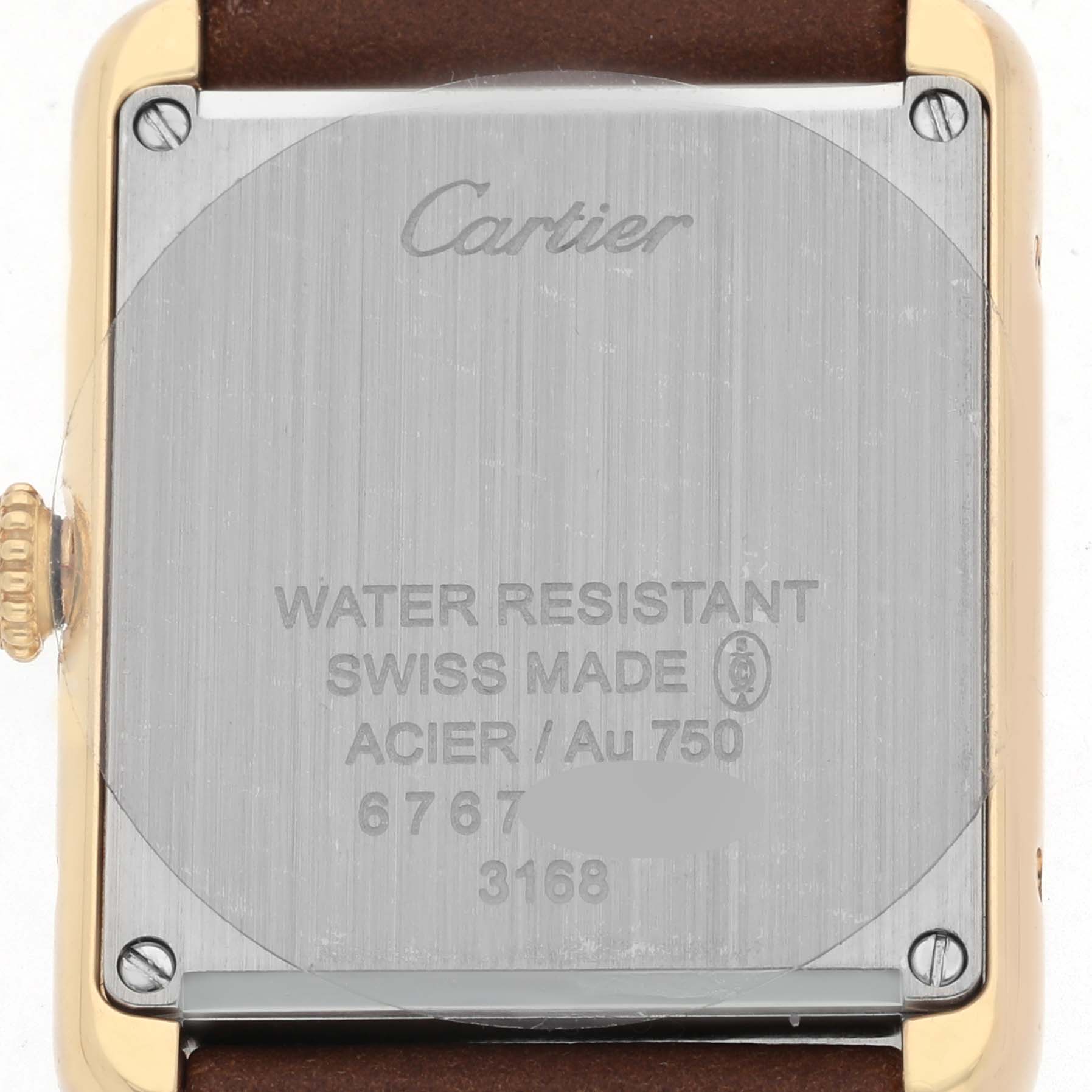 The image shows the back of a Cartier Tank Solo W5200002 Women's Yellow Gold Silver Dial watch, highlighting its case back and crown from a straight-on angle.