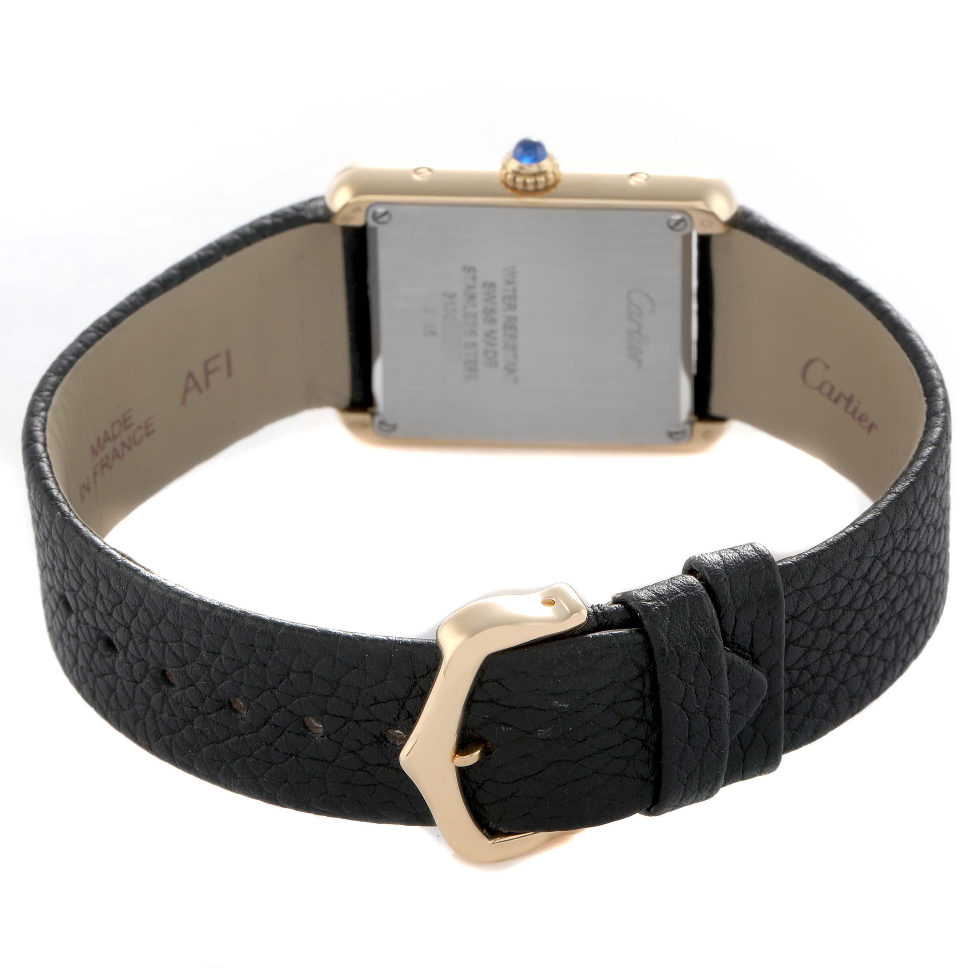 The image shows the back of a Cartier Tank Solo W5200002 Women's Yellow Gold Silver Dial watch, highlighting the leather strap and buckle.