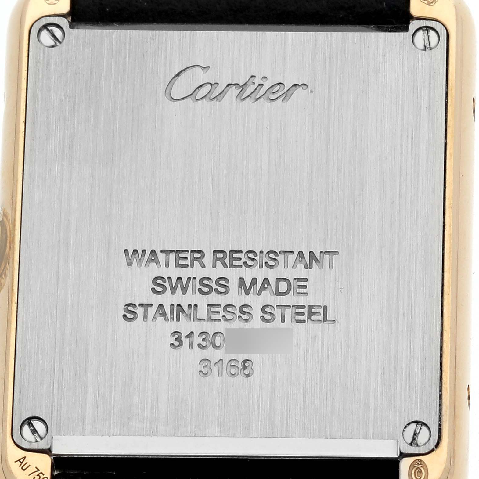 The image shows the back of a Cartier Tank Solo W5200002 Women's Yellow Gold Silver Dial watch, highlighting engraving details and model specifics.