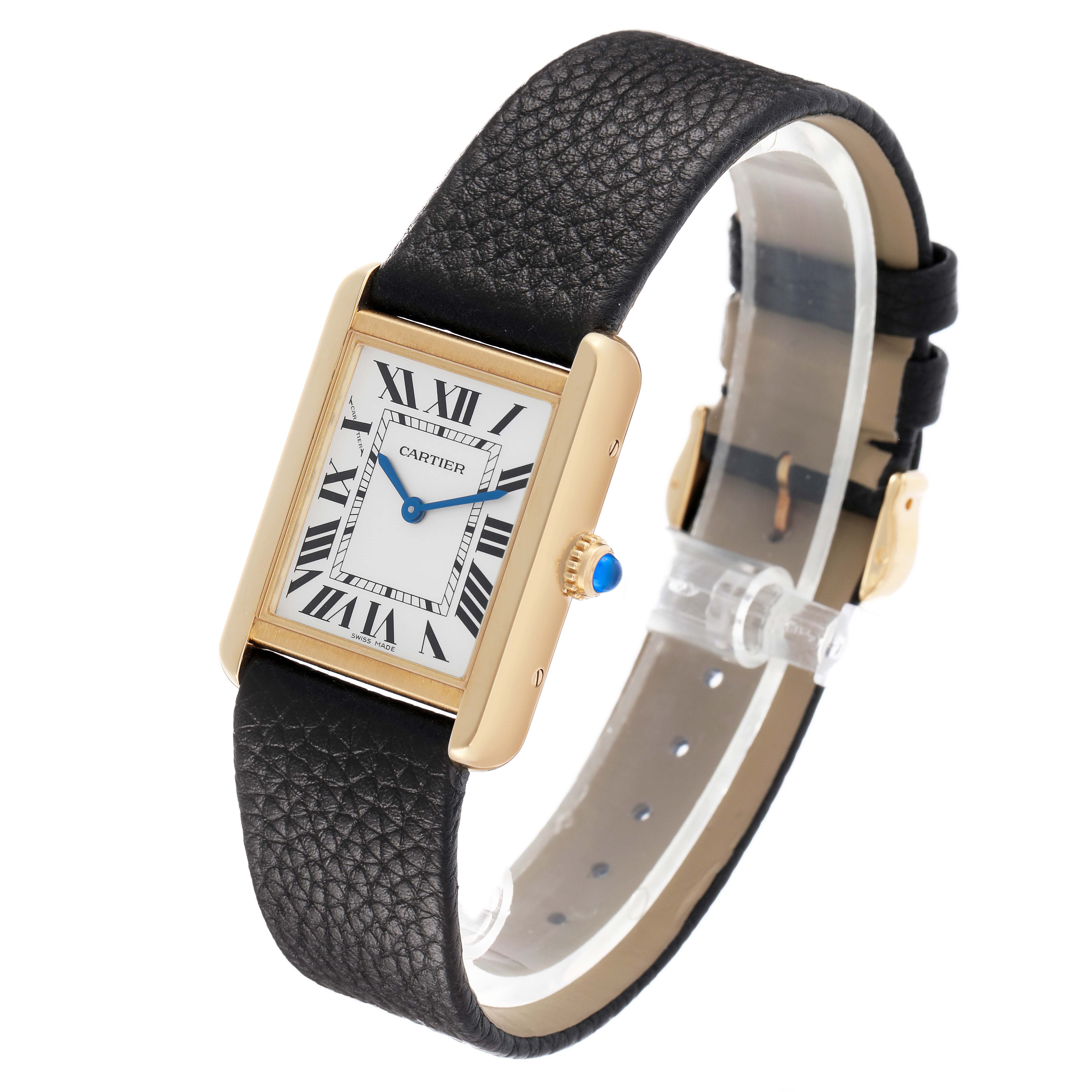 The Cartier Tank Solo W5200002 Women's Yellow Gold Silver Dial watch is shown at an angled side view, highlighting its rectangular face, Roman numerals, leather strap, and winder.