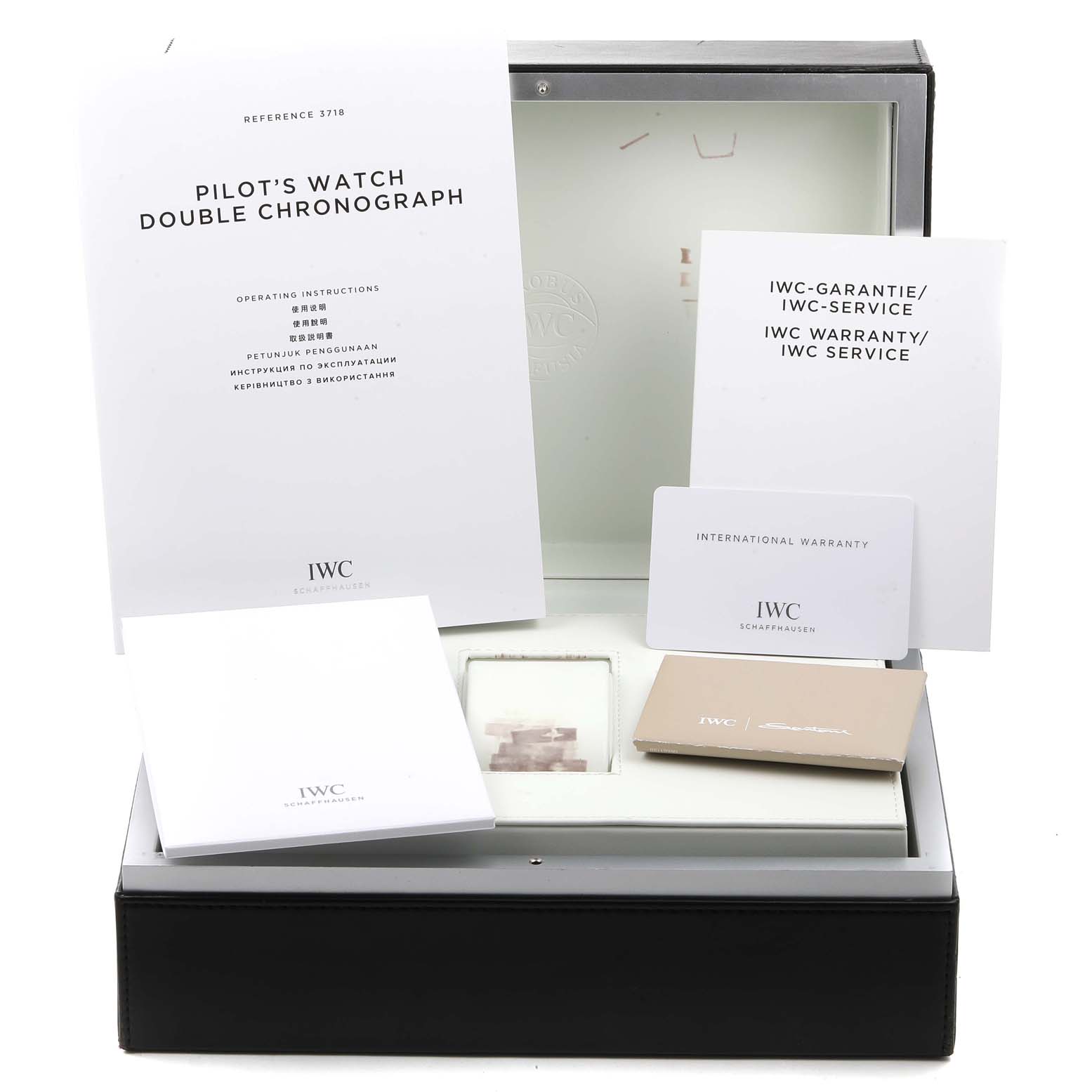 The image shows the packaging and documents for the IWC Pilot IW371808 Men's Stainless Steel Brown Dial IW371808 Men's Stainless Steel Brown Dial's Watch, including manuals, warranty card, and service information.