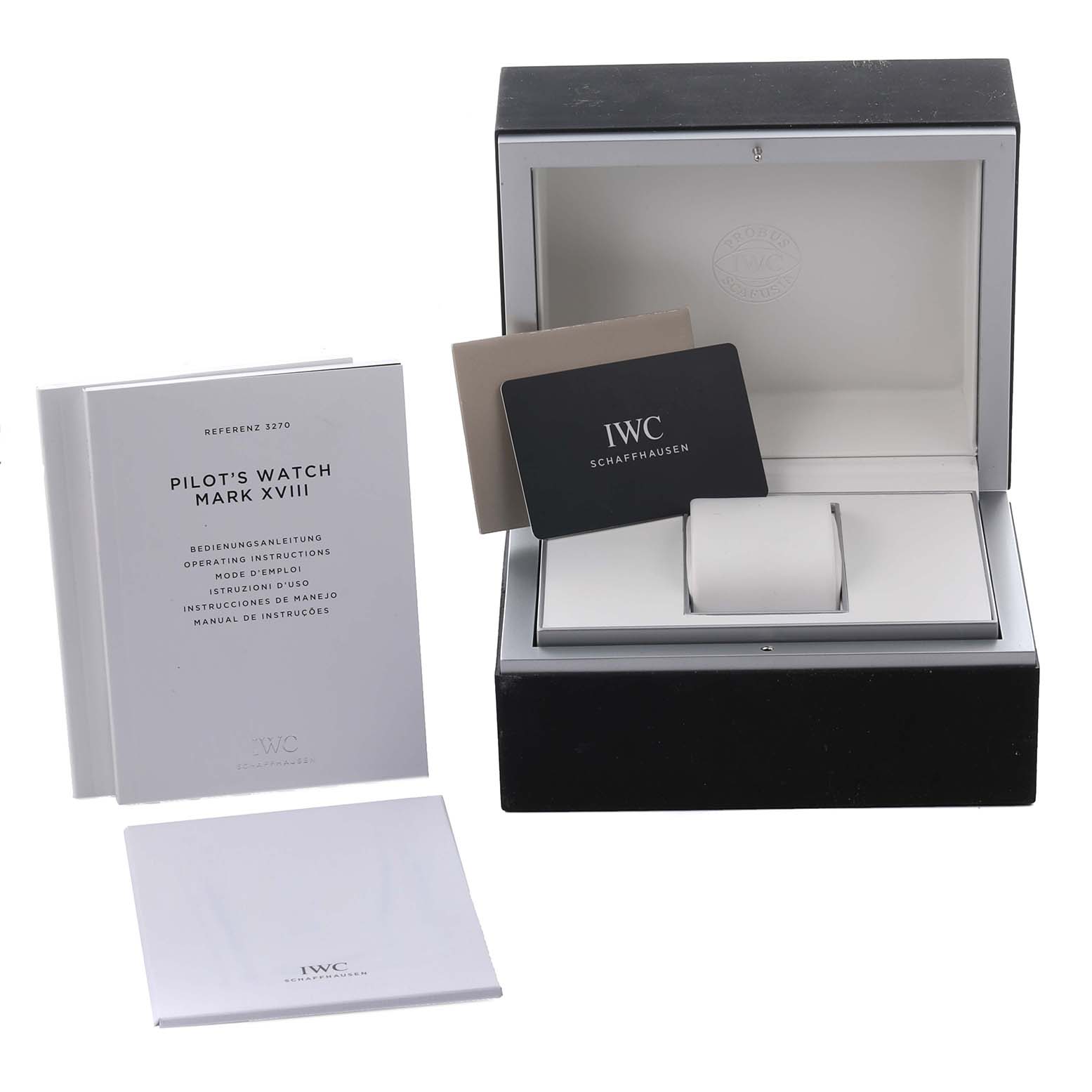 The image shows the packaging, documentation, and warranty card for the IWC Pilot IW327002 Men's Stainless Steel White Dial IW327002 Men's Stainless Steel White Dial's Watch model.