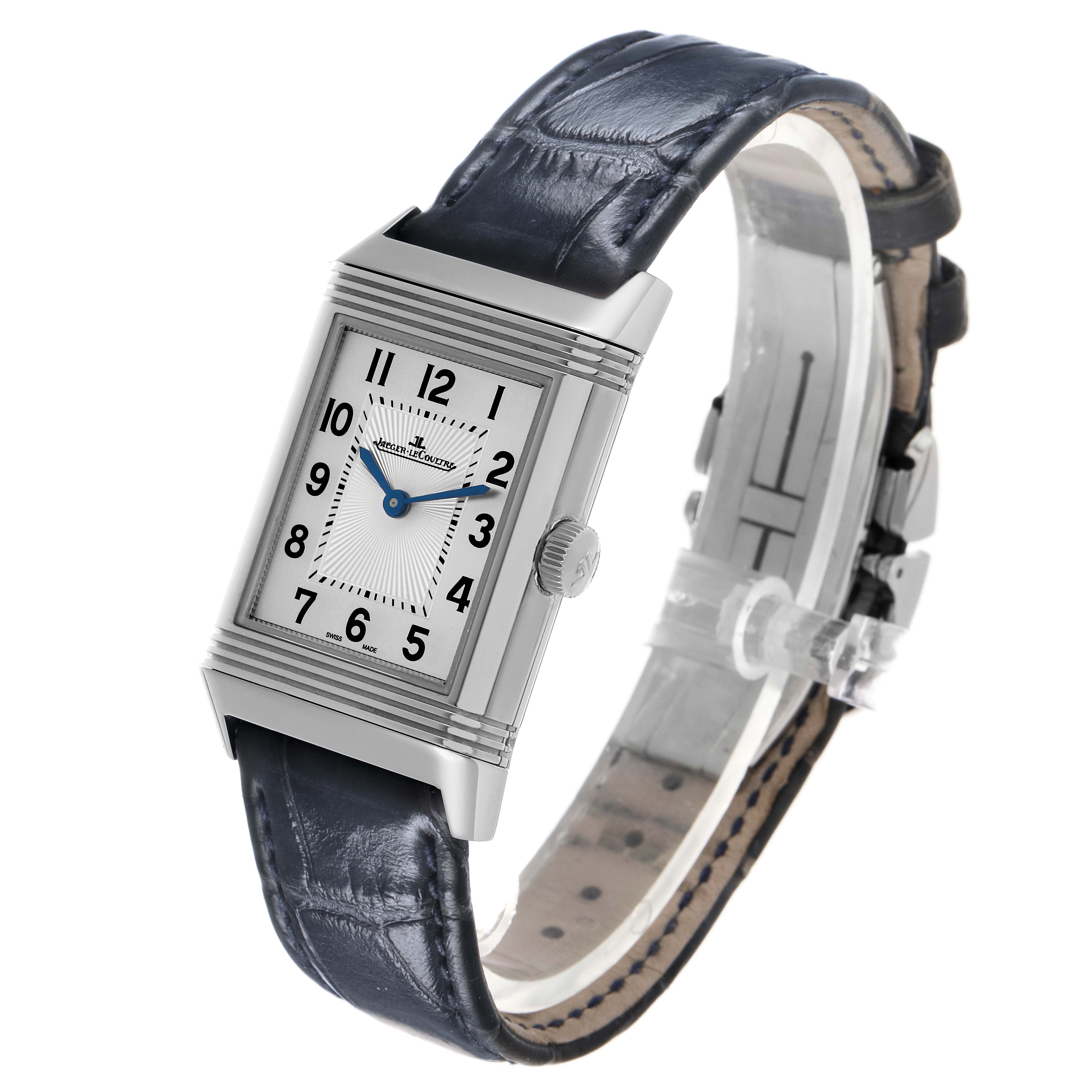The Jaeger-LeCoultre Reverso watch is shown at a front-side angle, highlighting the face, dial, case, crown, and strap.