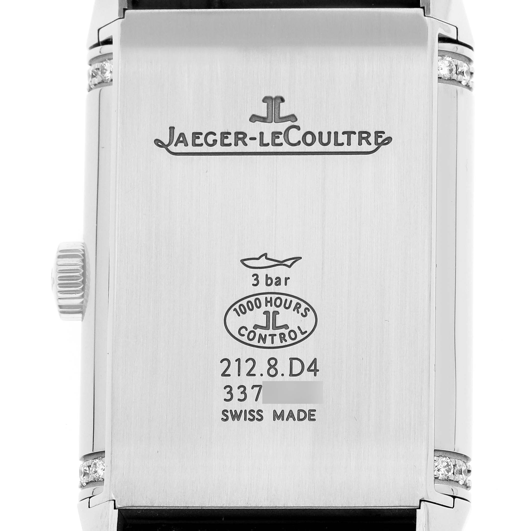 The image shows the back case of the Jaeger-LeCoultre Reverso watch, highlighting the brand, model details, and control engravings.