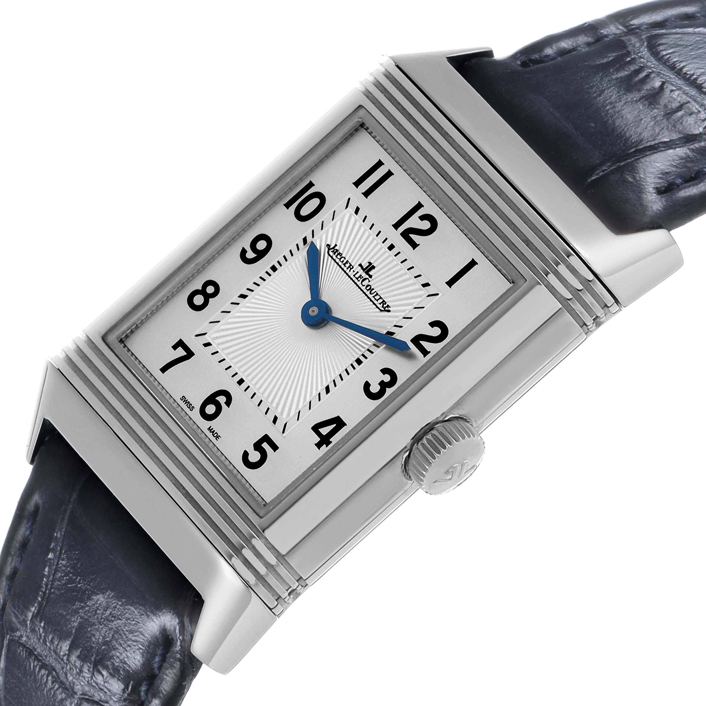 The Jaeger-LeCoultre Reverso watch is shown from an angled side view, displaying the dial, crown, and leather strap.
