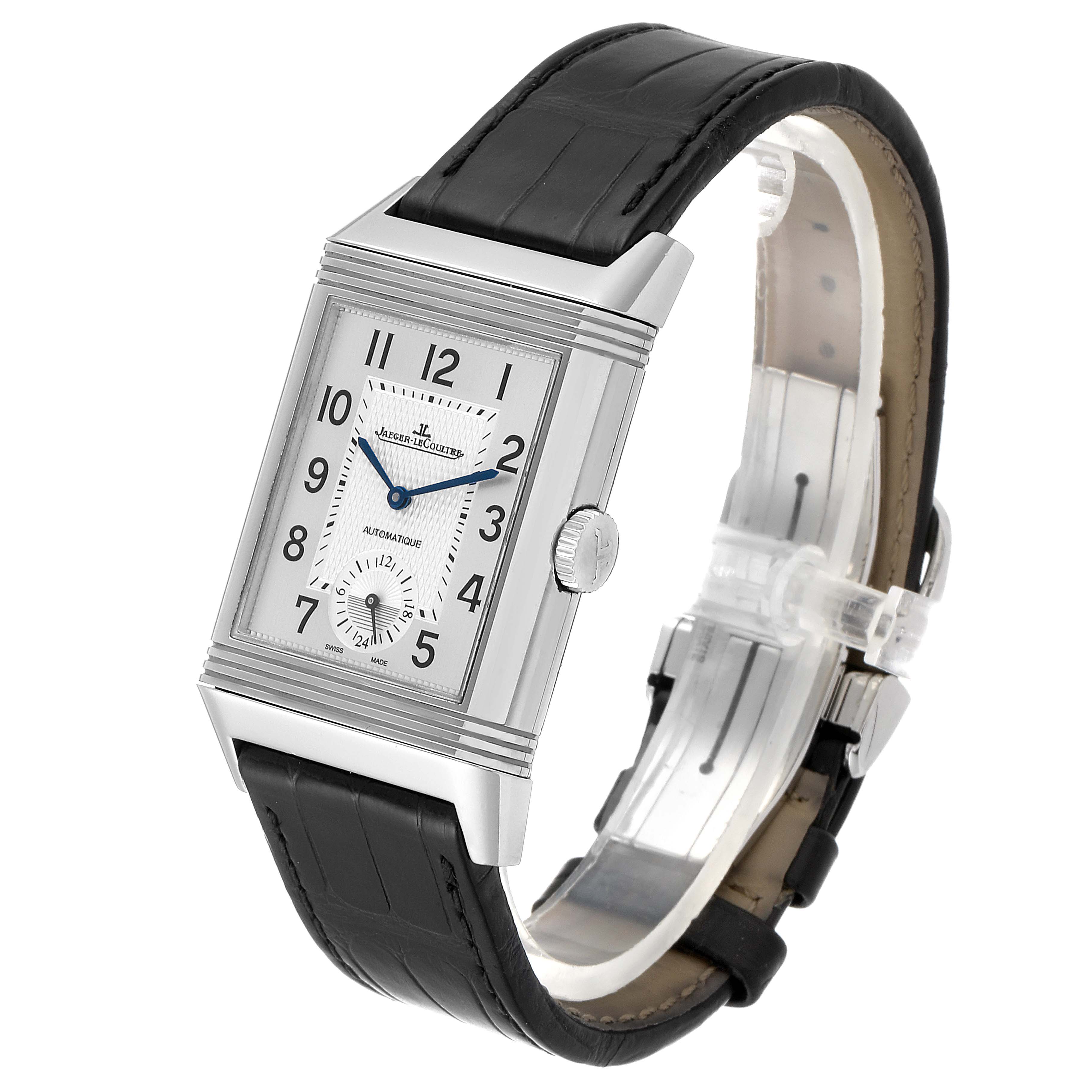 The image shows a Jaeger-LeCoultre Reverso watch at a front-right angle, highlighting the dial, crown, and black leather strap.