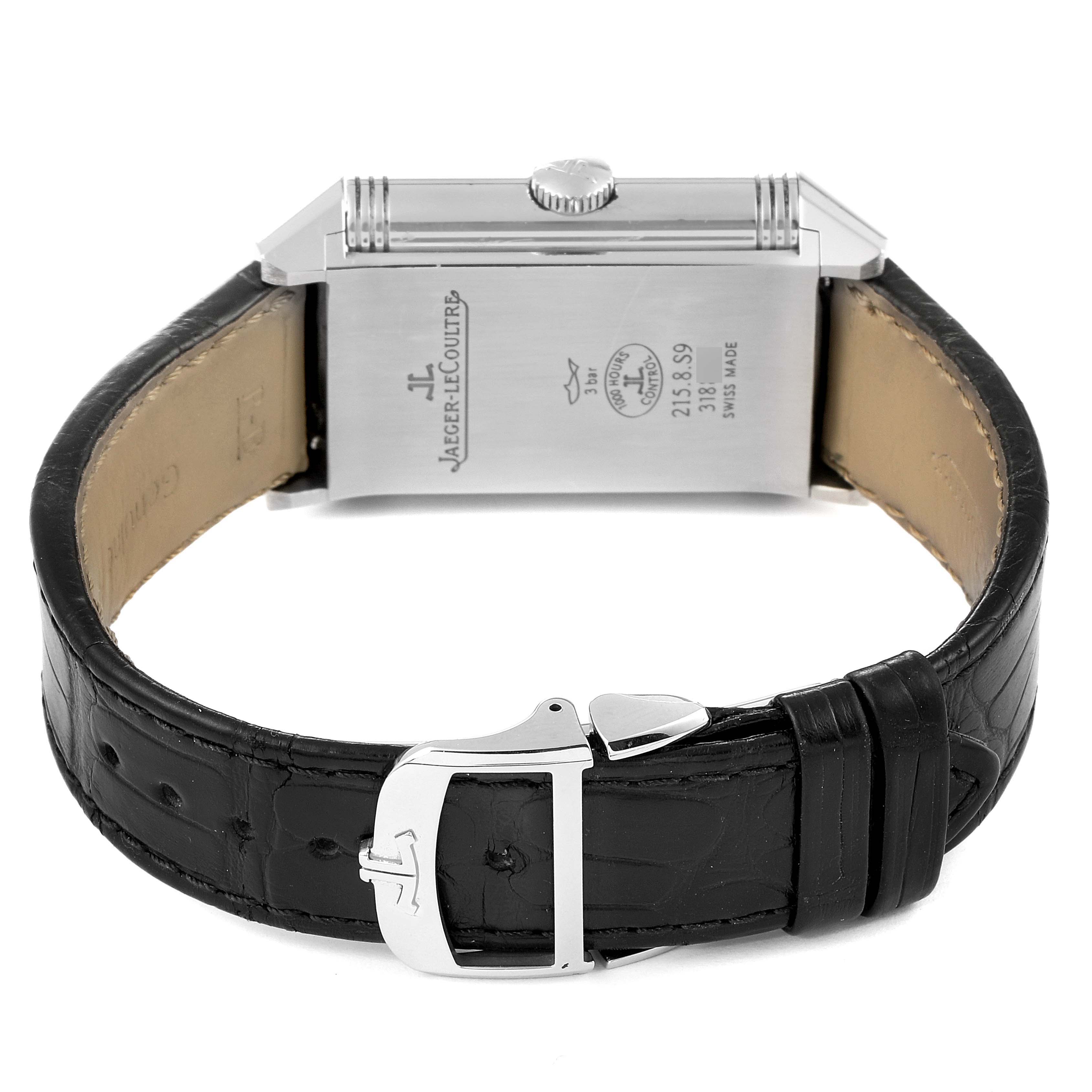 The image shows the back view of a Jaeger LeCoultre Reverso Q3838420 Men's Stainless Steel Silver Dial Q3838420 Men's Stainless Steel Silver Dial watch, highlighting the case back, crown, and leather strap with a clasp.