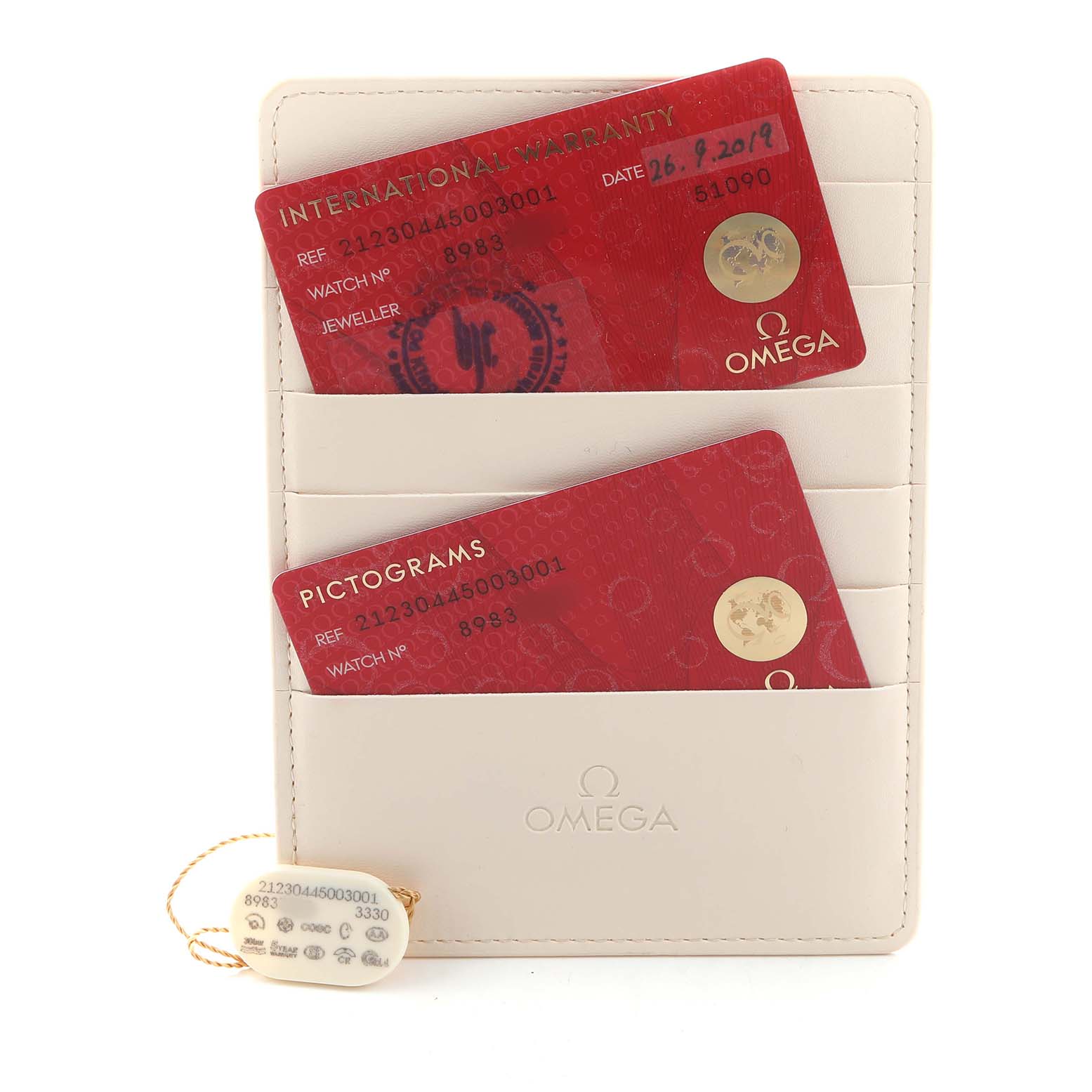 The image shows the Omega Seamaster 212.30.44.50.03.001 Men's Stainless Steel Blue Dial's international warranty and pictogram cards in a card holder, with a tag attached.