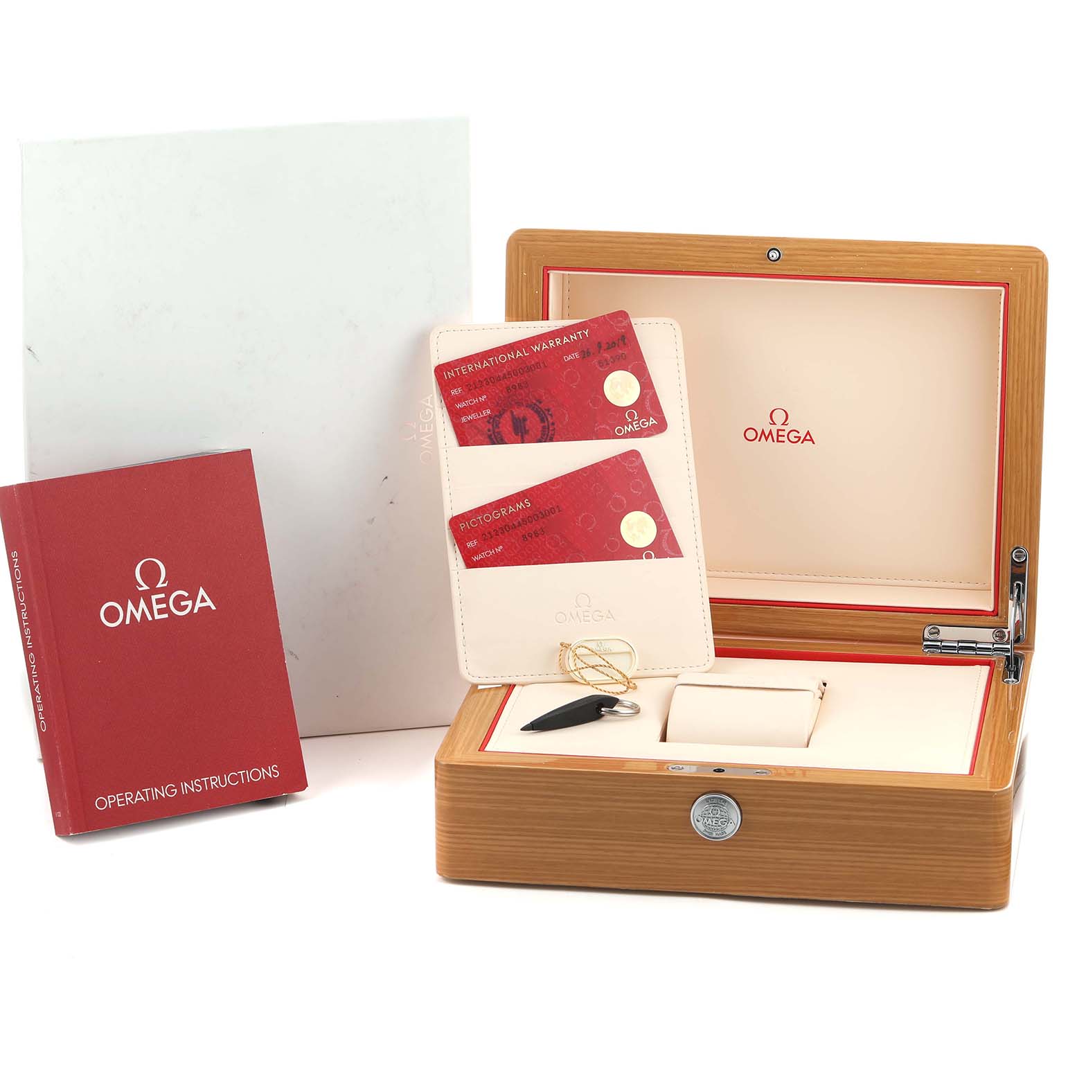 The image shows an Omega Seamaster 212.30.44.50.03.001 Men's Stainless Steel Blue Dial box with warranty cards, a holder, and an operating instructions booklet.