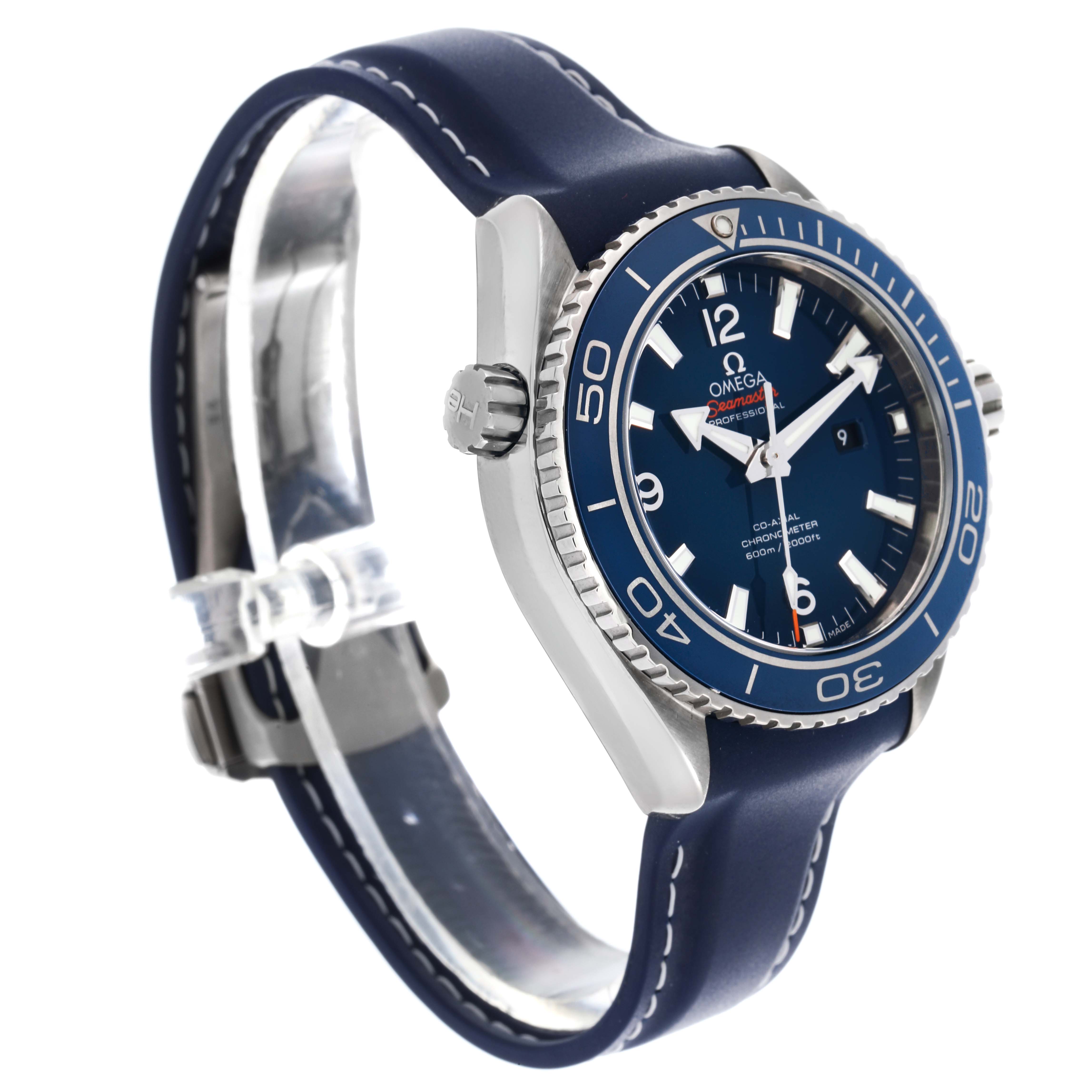 The Omega Seamaster Planet Ocean watch is shown at a three-quarter angle, highlighting the blue dial, bezel, and strap.