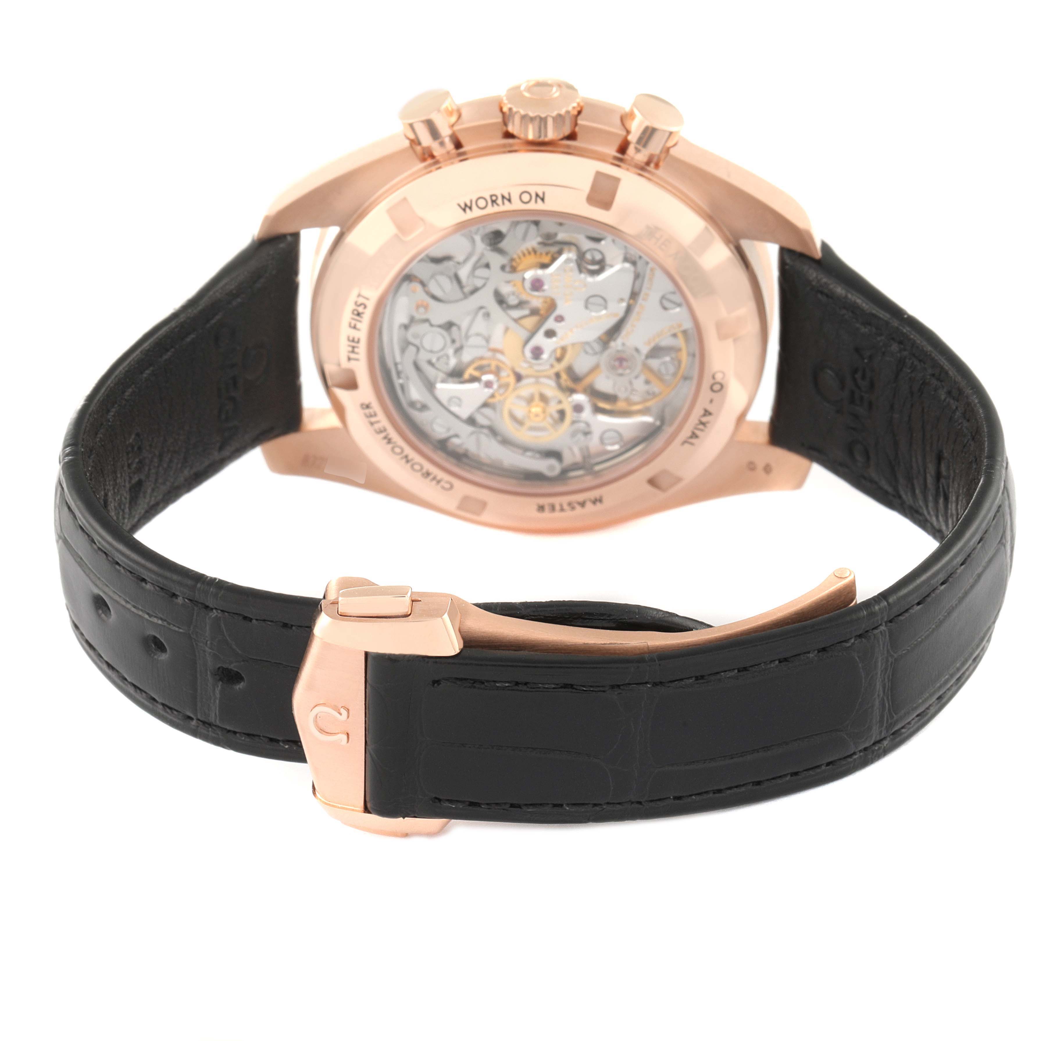 The image shows the back view of an Omega Speedmaster 310.63.42.50.01.001 Men
s Rose Gold Black Dial 310.63.42.50.01.001 Men
s Rose Gold Black Dial watch, highlighting its movement, case back, and leather strap.