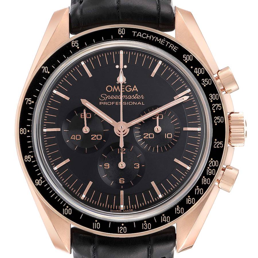 The image shows a front view of an Omega Speedmaster watch, displaying its black dial, chronograph subdials, tachymeter bezel, and leather strap.