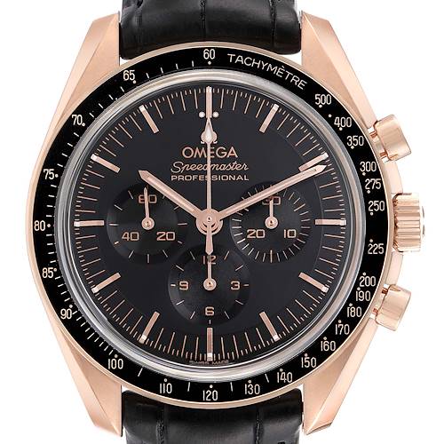 The image shows a front view of an Omega Speedmaster watch, highlighting its black dial, rose gold case, and chronograph sub-dials.