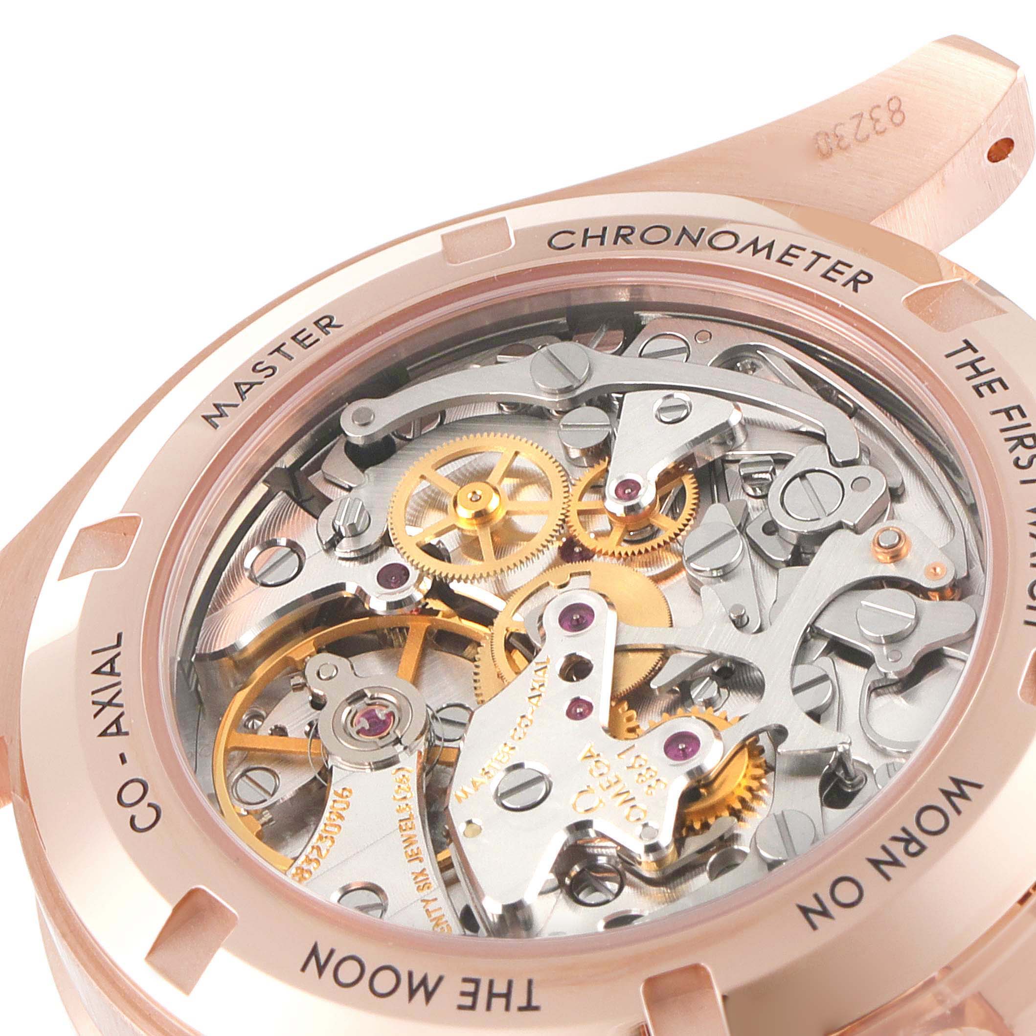 This image shows the Omega Speedmaster 310.63.42.50.01.001 Men
s Rose Gold Black Dial 310.63.42.50.01.001 Men
s Rose Gold Black Dial
s movement through its transparent case back, revealing the intricate gears and components.