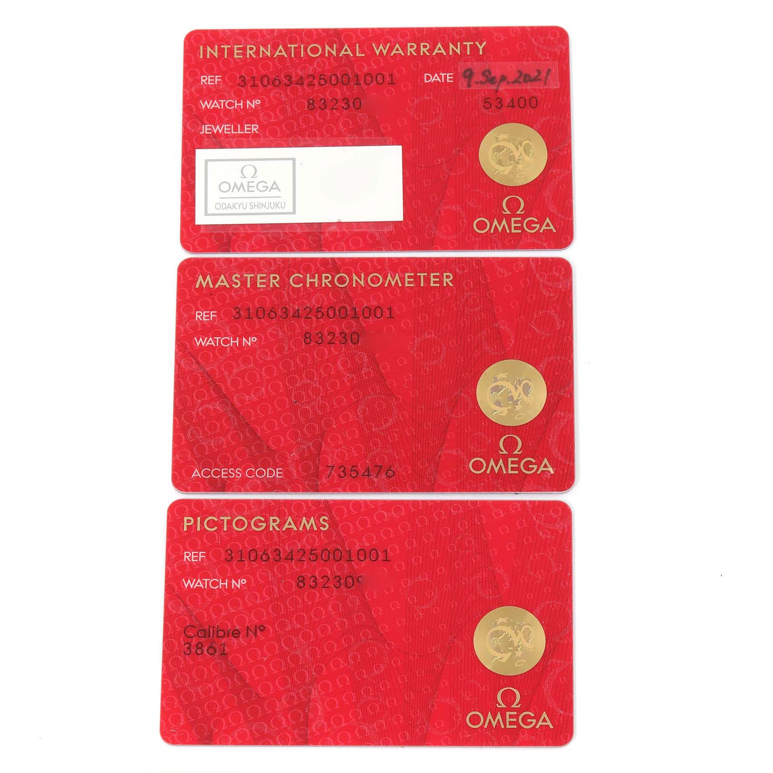 The image shows three red cards with gold details for the Omega Speedmaster 310.63.42.50.01.001 Men
s Rose Gold Black Dial 310.63.42.50.01.001 Men
s Rose Gold Black Dial model: an International Warranty card, a Master Chronometer card, and a Pictograms card.