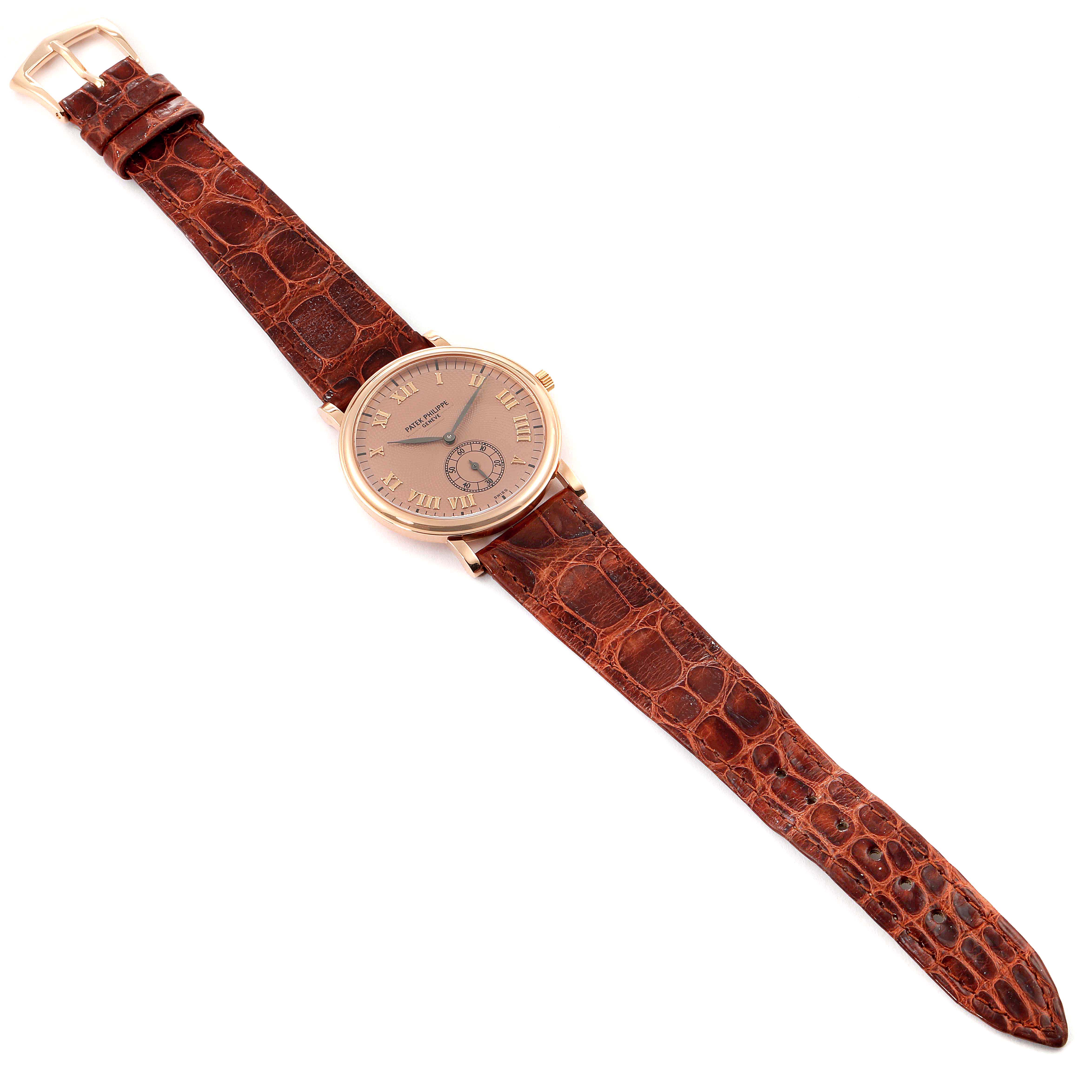 This image shows a full view of a Patek Philippe Calatrava 5022R Men's Rose Gold Pink Dial 5022R Men's Rose Gold Pink Dial watch, showcasing its dial and brown leather strap from an overhead angle.