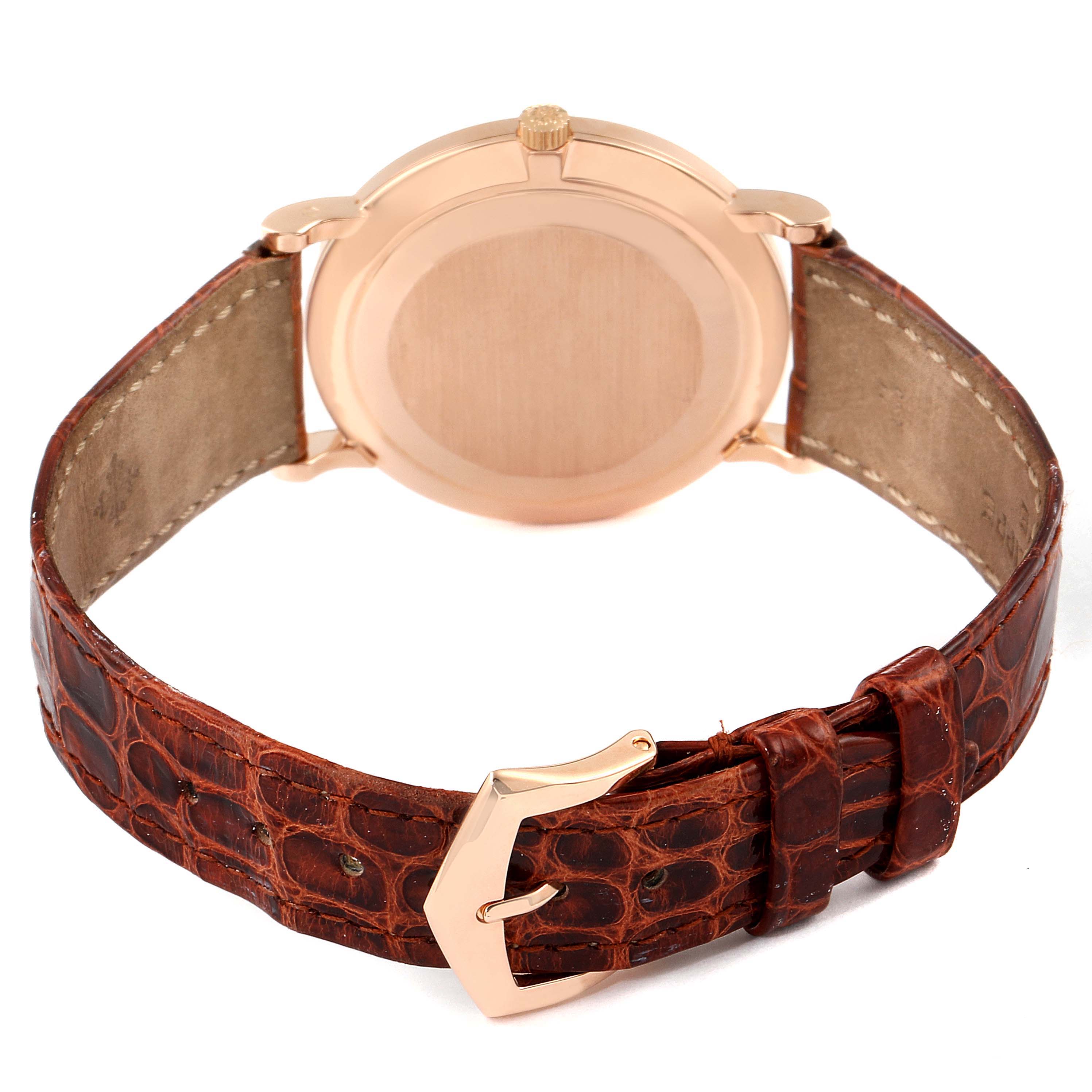 The image shows the back case and leather strap with clasp of a Patek Philippe Calatrava 5022R Men's Rose Gold Pink Dial 5022R Men's Rose Gold Pink Dial watch.