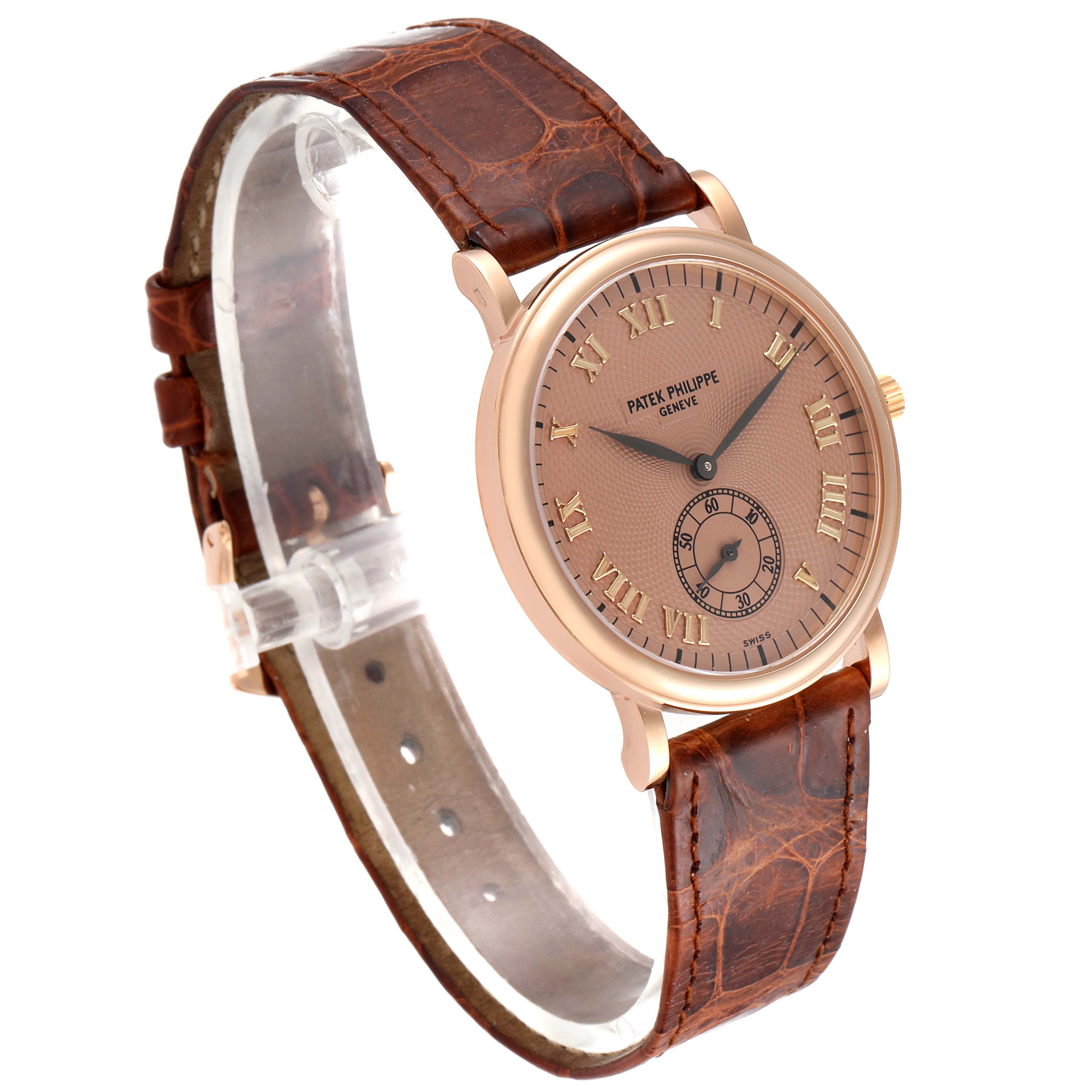 The image shows a Patek Philippe Calatrava 5022R Men's Rose Gold Pink Dial 5022R Men's Rose Gold Pink Dial watch at a three-quarter angle, highlighting its leather strap, gold casing, and dial details.