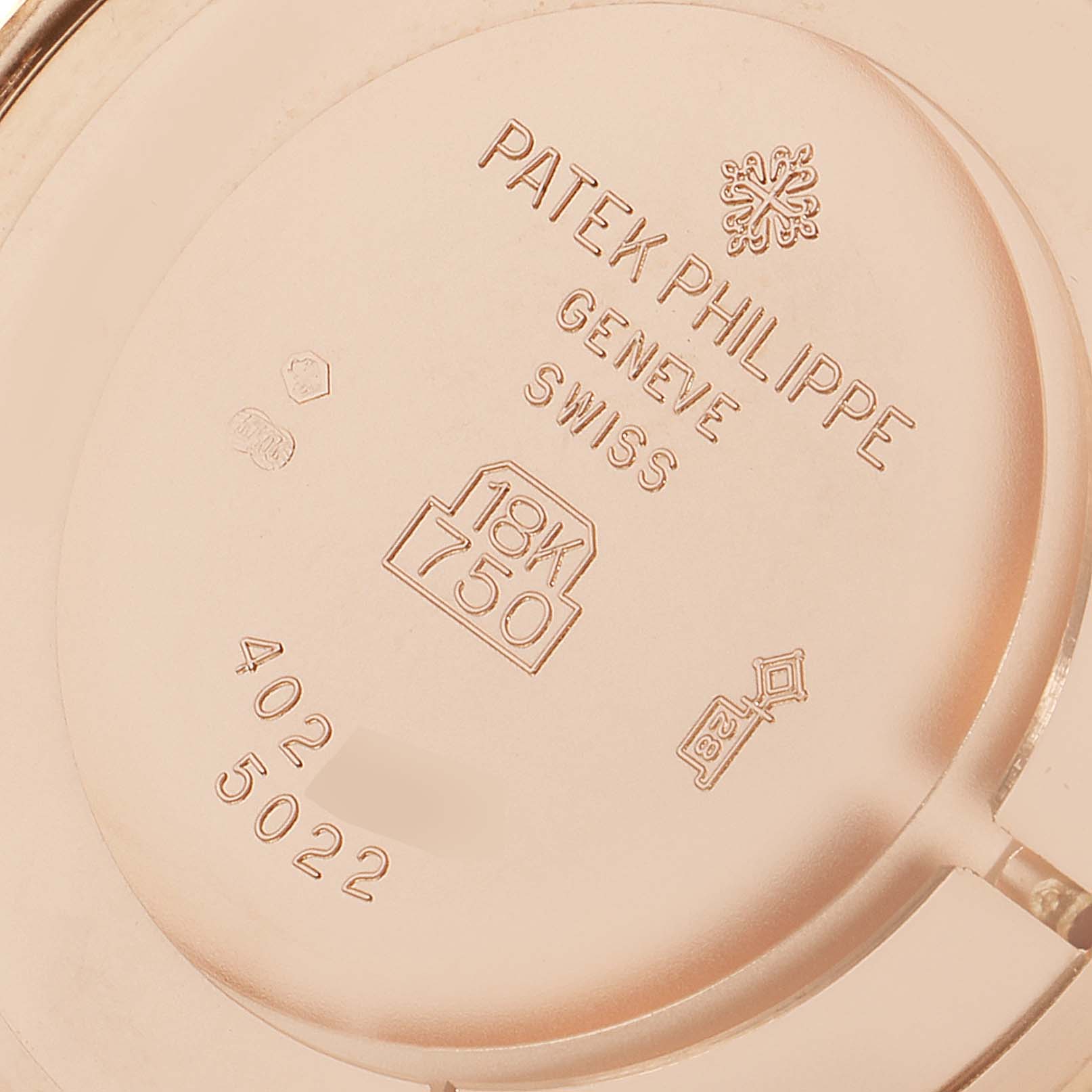 The image shows the case back of a Patek Philippe Calatrava 5022R Men's Rose Gold Pink Dial 5022R Men's Rose Gold Pink Dial watch, displaying markings and hallmarks.