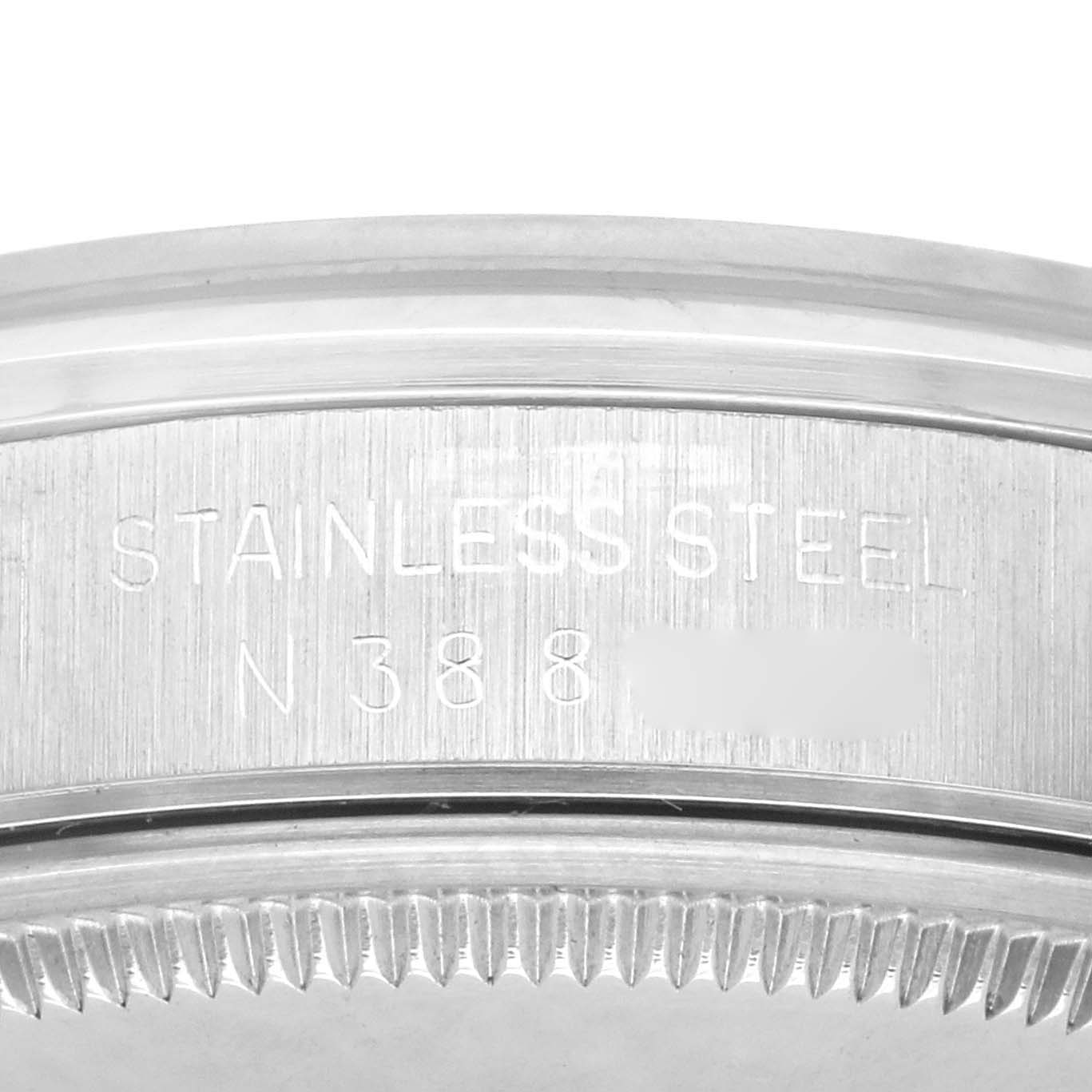 The image shows a close-up of the side of a Rolex Air-King 14000 Men's Stainless Steel Blue Dial 14000 Men's Stainless Steel Blue Dial watch case, highlighting the stainless steel material and engravings.