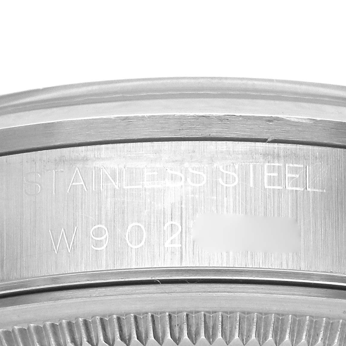 The image shows a close-up of the side engraving on a Rolex Air-King 14000 Men's Stainless Steel Black Dial 14000 Men's Stainless Steel Black Dial, highlighting "Stainless Steel."