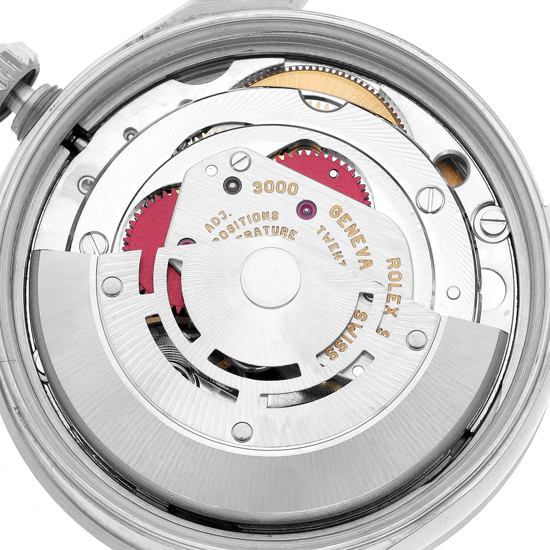 The image shows the movement of a Rolex Air-King 14010M Men's Stainless Steel Silver Dial watch, highlighting gears and the winding rotor from the back.