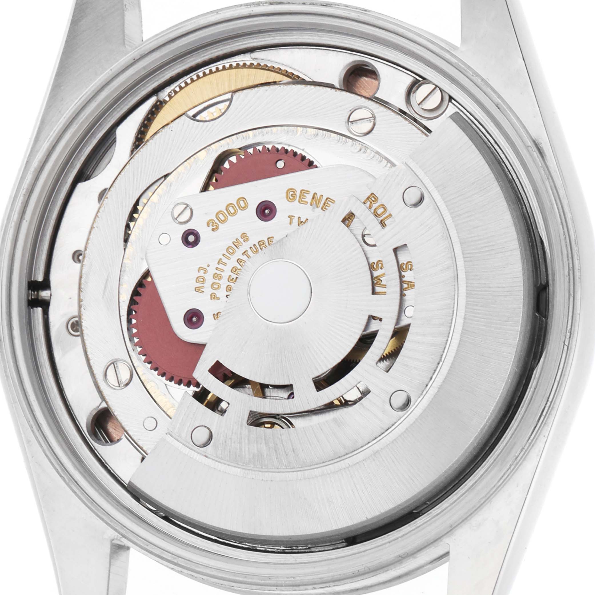 The image shows a close-up of the Rolex Air-King 14000 Men's Stainless Steel Pink Dial's movement from the back, highlighting intricate gears and the rotor.