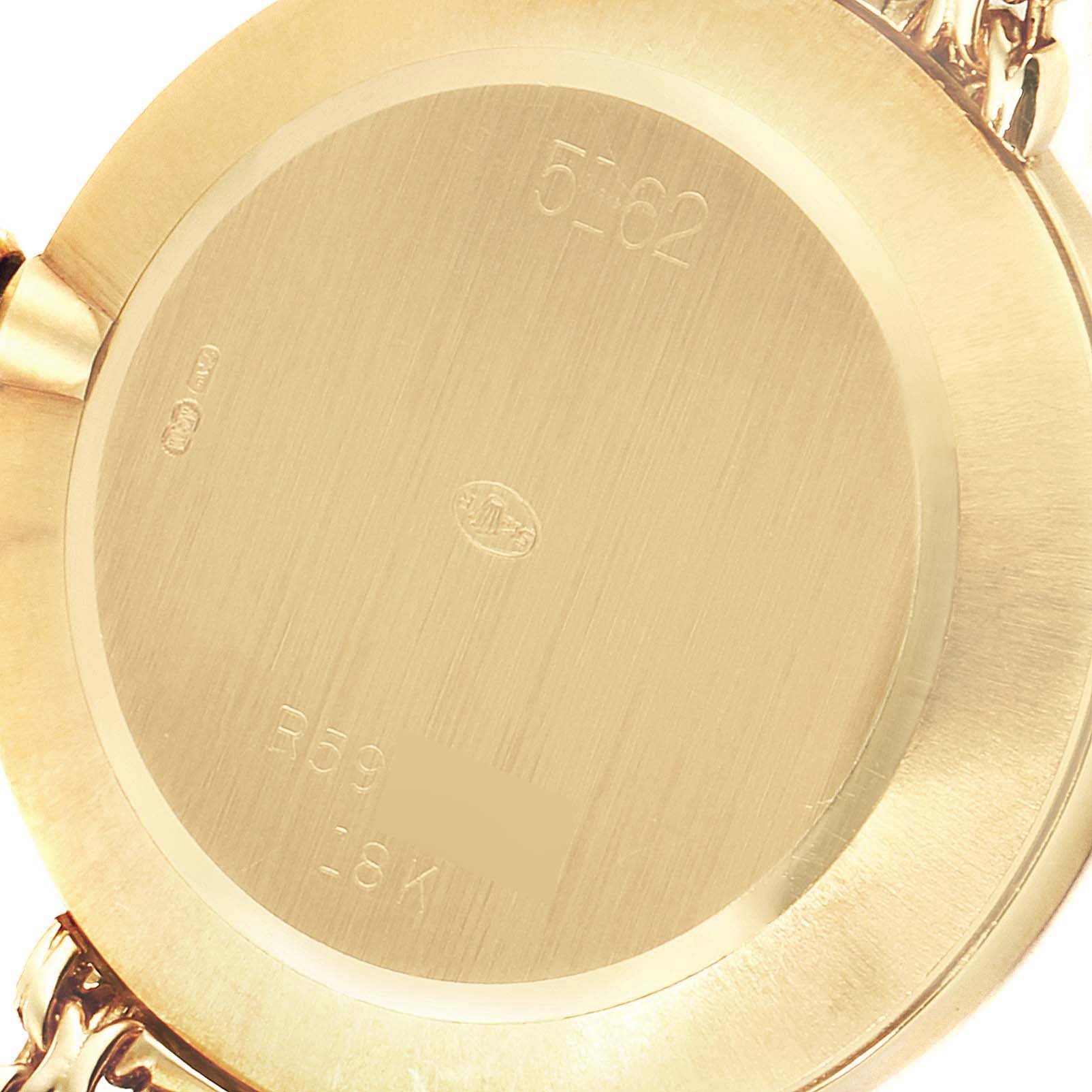 The image shows the back case of a Rolex Cellini 5162 Men
s Yellow Gold Mother of Pearl Dial 5162 Men
s Yellow Gold Mother of Pearl Dial watch with legible engravings.