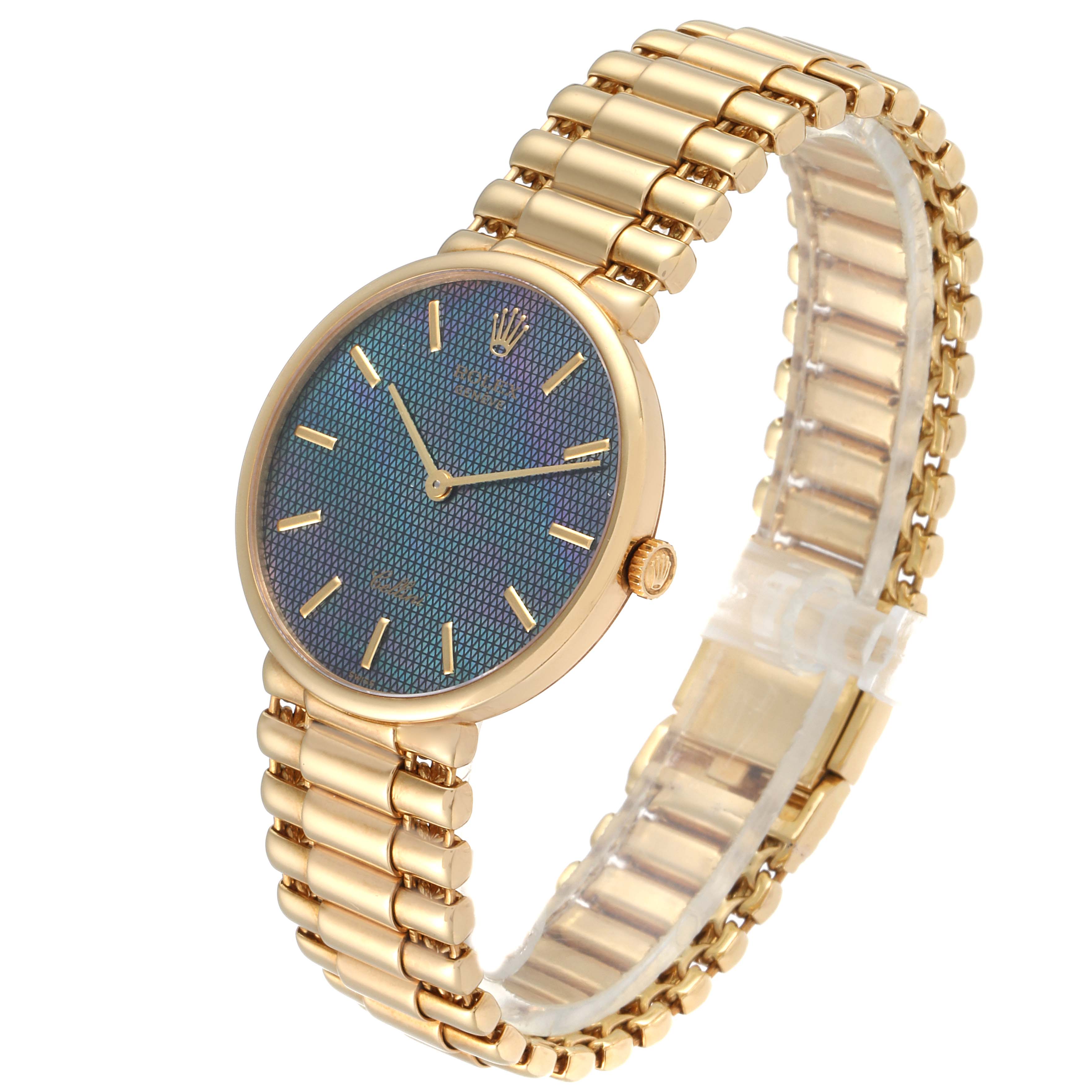 The Rolex Cellini 5162 Men
s Yellow Gold Mother of Pearl Dial 5162 Men
s Yellow Gold Mother of Pearl Dial watch is shown at a three-quarter angle, highlighting its gold bracelet, blue textured dial, and gold crown.