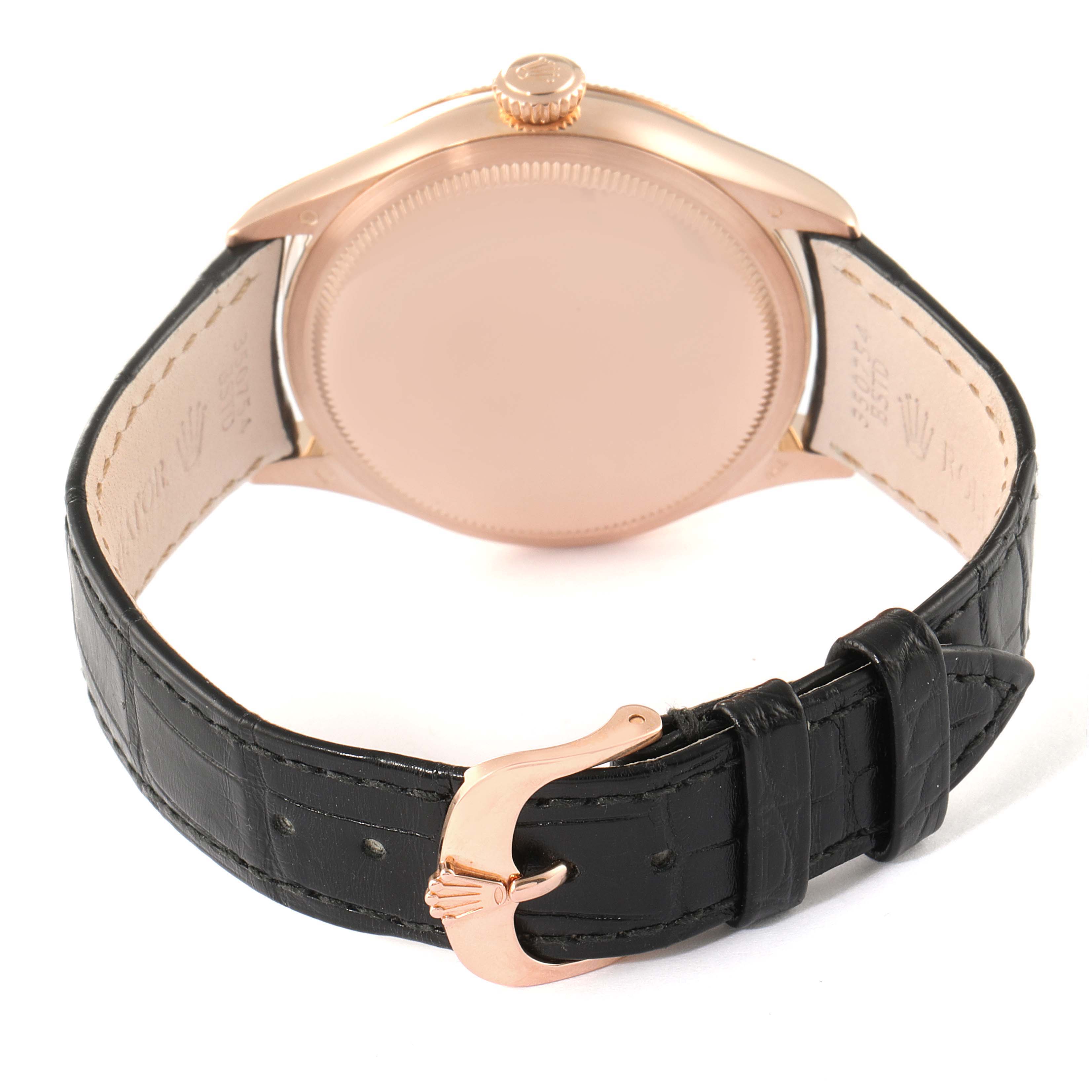 The image shows the back of a Rolex Cellini 50505 Men
s Rose Gold White Dial 50505 Men
s Rose Gold White Dial watch, highlighting the case, crown, and leather strap with a clasp.
