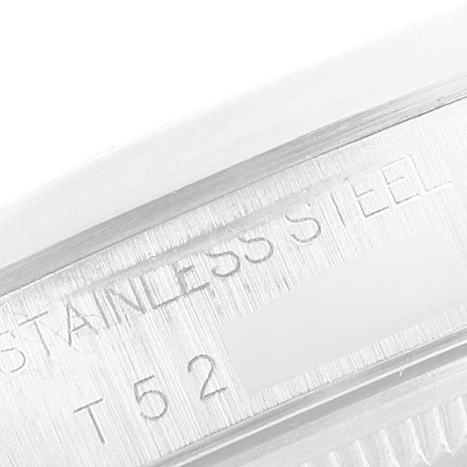 The image shows a close-up view of the side of the Rolex Date 15200 Men's Stainless Steel White Dial 15200 Men's Stainless Steel White Dial watch case, featuring "STAINLESS STEEL" engraving.